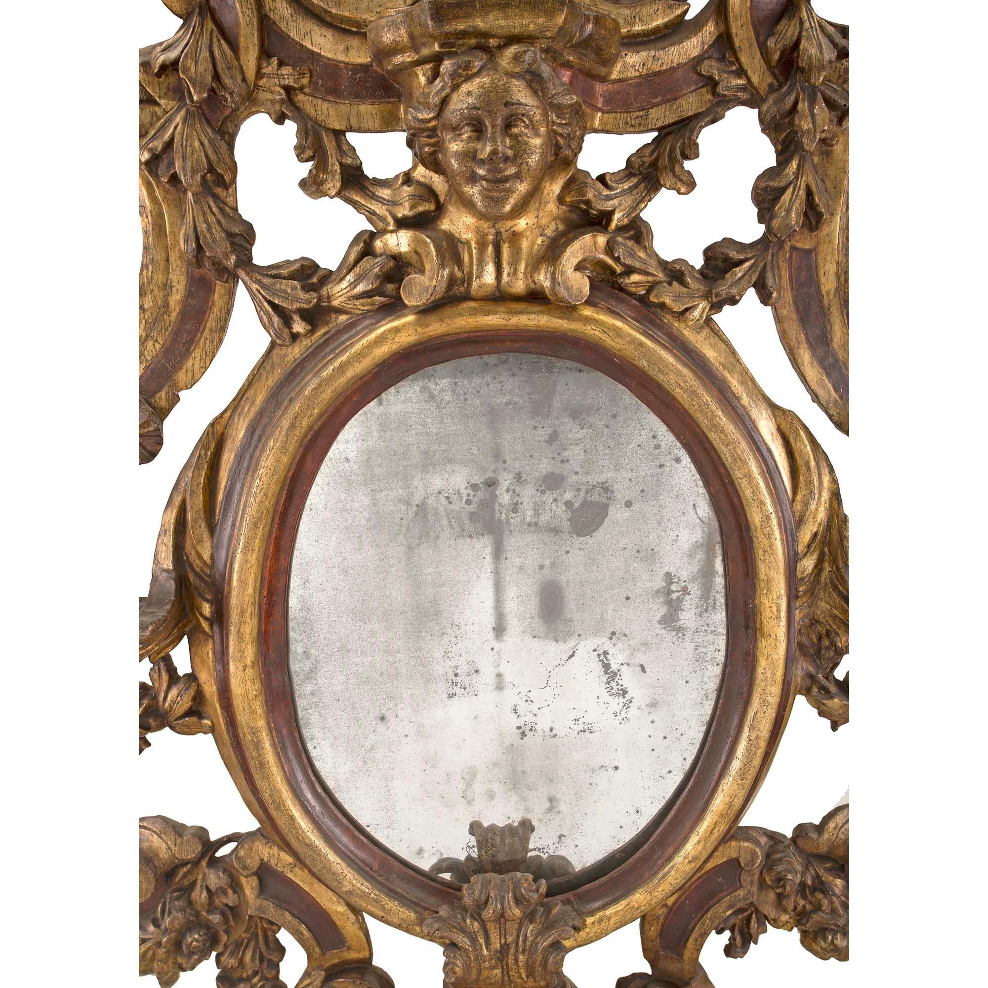 A most impressive Italian 17th century Sicilian Mecca and polychrome oval mirror circa 1650. The original mirror plate is framed within an oval mottled warm polychrome and Mecca border. The unique and extremely decorative frame displays striking