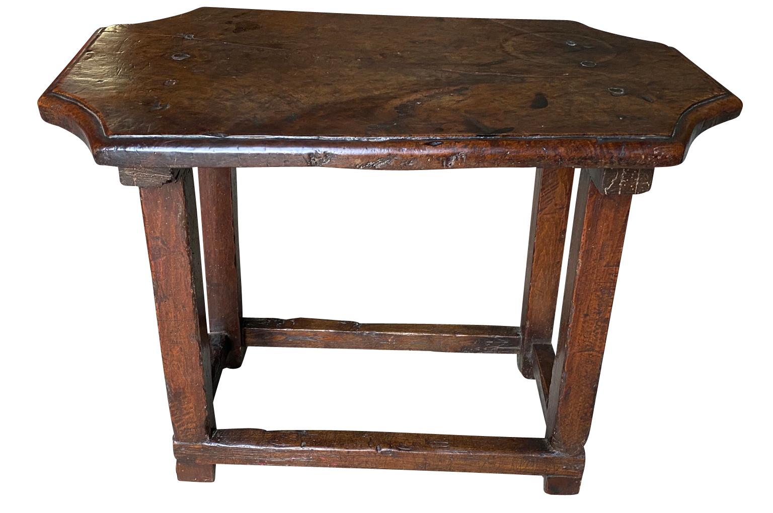 An exquisite 17th century side table from Bologna, Italy. Beautifully constructed from walnut and oak with a very handsome edge finish to the top. Wonderful patina and graining, very rich and luminous.