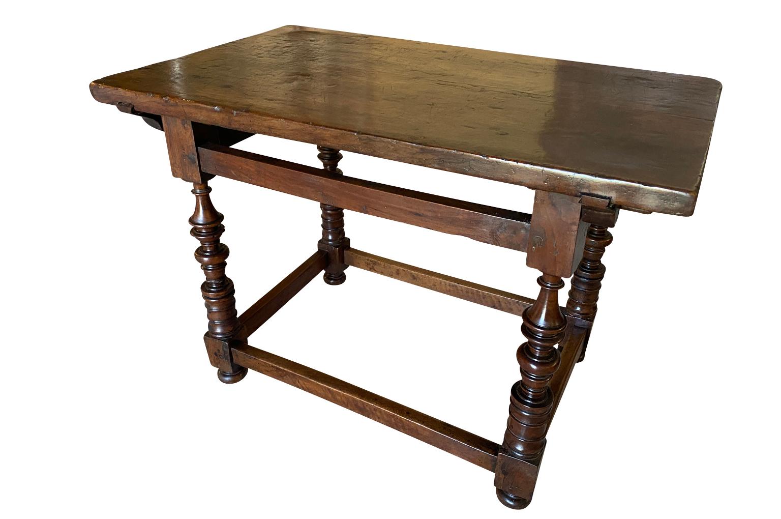 A sensational 17th century Side Table from the Tuscan region of Italy. Beautifully constructed from sumptuous walnut with solid board top and Rocchetto style legs. Gorgeous patina.