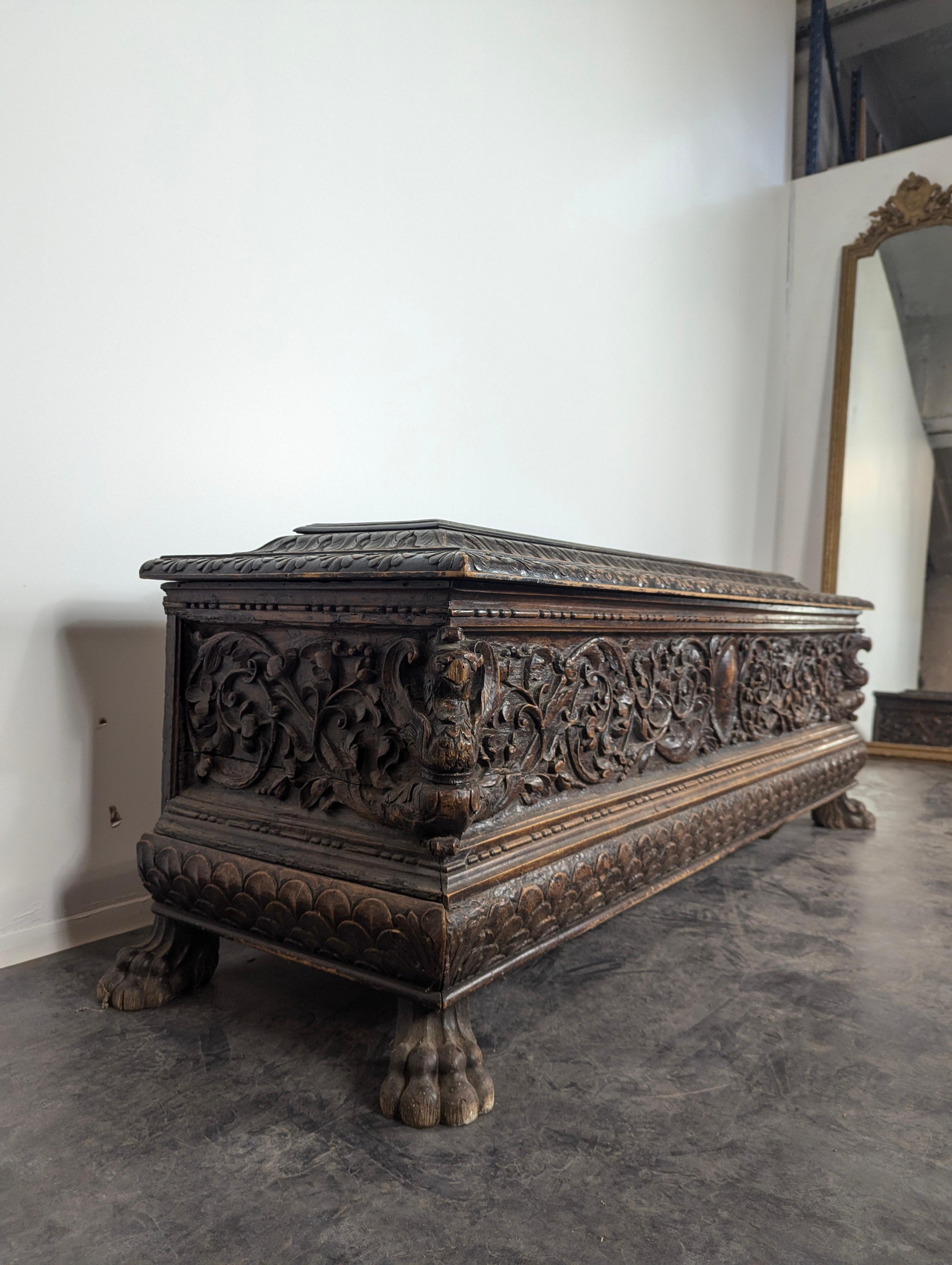 This Italian 17th-century walnut cassone is a remarkable example of Renaissance craftsmanship, embodying the grandeur and artistry of the period. Made from rich walnut, the cassone, or chest, features beautifully carved panels with intricate