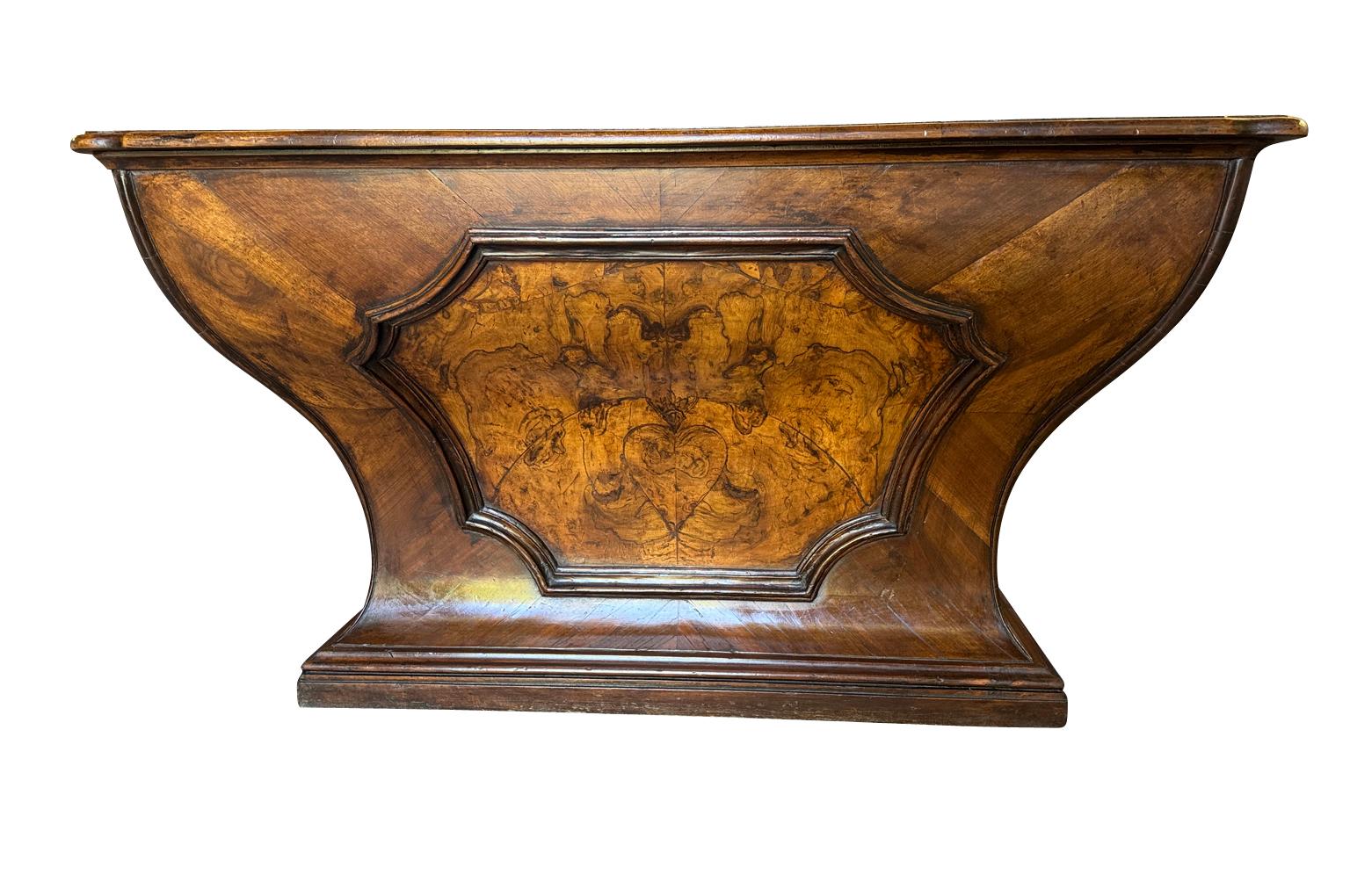 An outstanding 18th century Louis XIV Auctioneer’s Desk from Lombardy, Italy.  Beautifully constructed from walnut and olive wood veneer with three drawers in an altar-like form.  Exceptional patina.  A true statement piece for any living area.