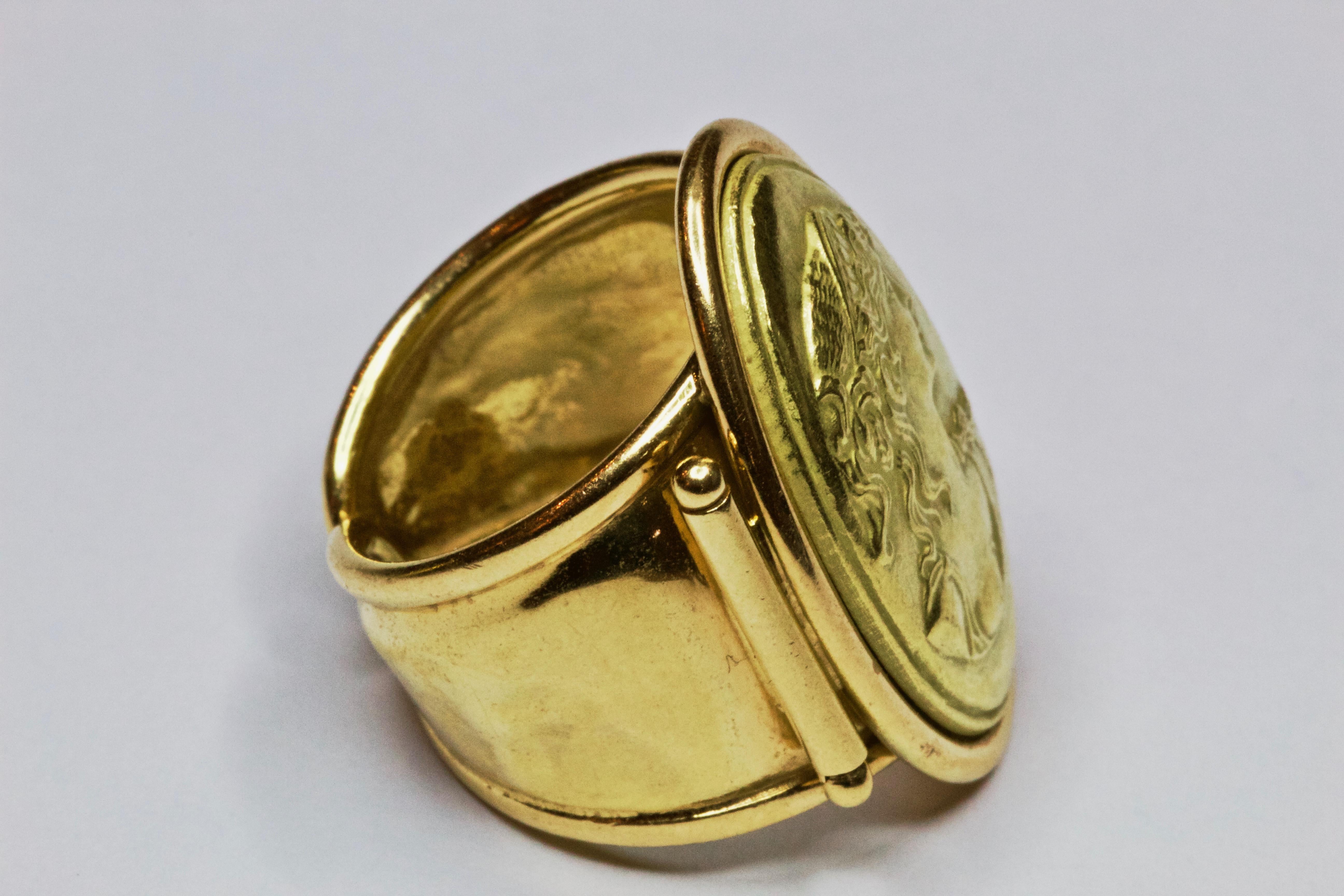 A fabulous example of an embossed portrait ring. beautifully modelled in a rich 18 carat yellow gold. makers mark 'AR'
Head: 25.89mm x 19.31mm 
Band Width: 13.42mm
Ring Size: L1/2 or 6  