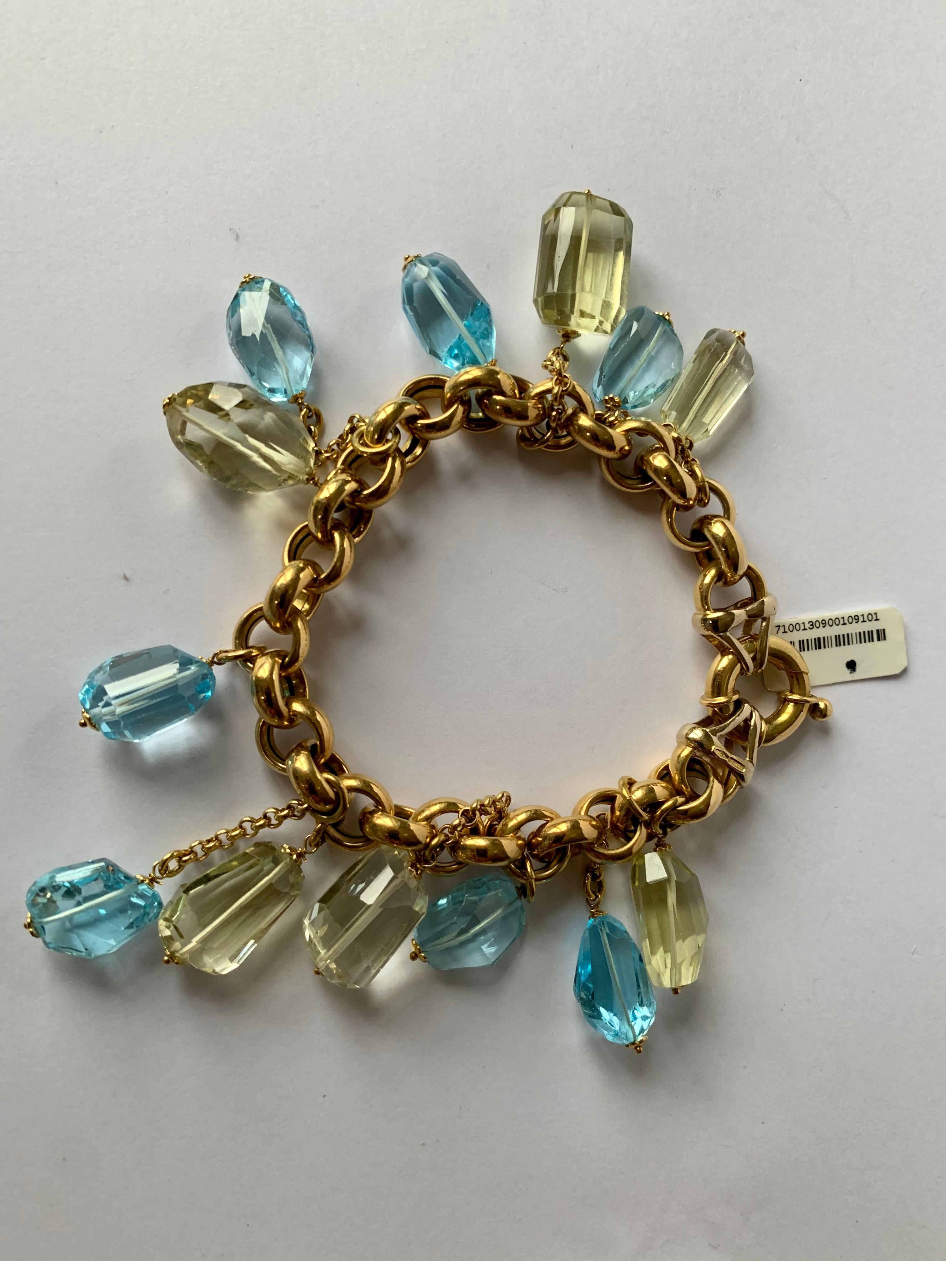 A lovely and playful 18 K yellow Gold charm bracelet with Blue Topaz and Lemon Citrine. 
A romantic design with pastel gemstones. 
Made in Italy. 
Length: 21 cm. 
Masterfully handcrafted piece! Authenticity and money back is guaranteed.
For any
