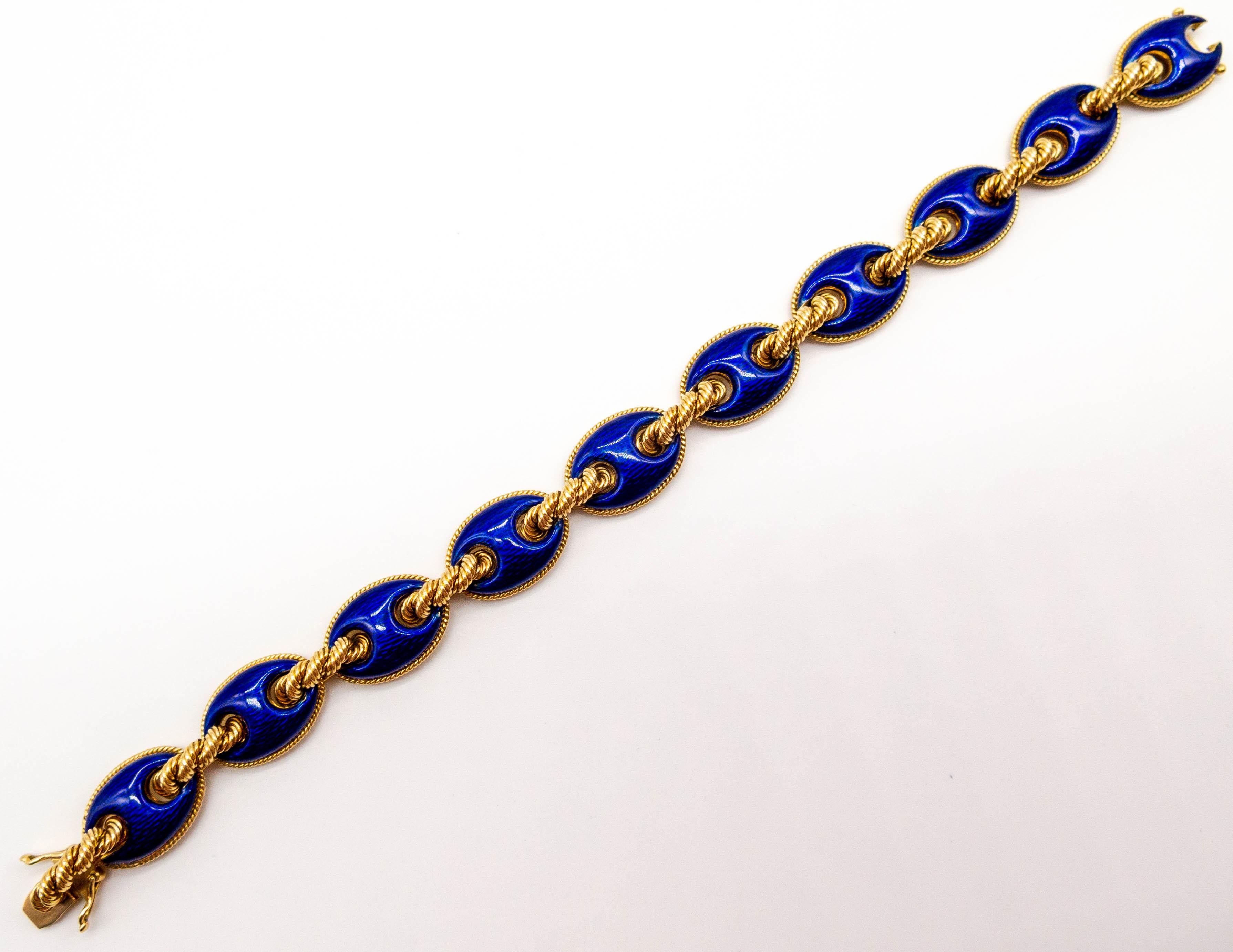 A superbly elegant and refined gold and deep blue enamel bracelet with 3/4