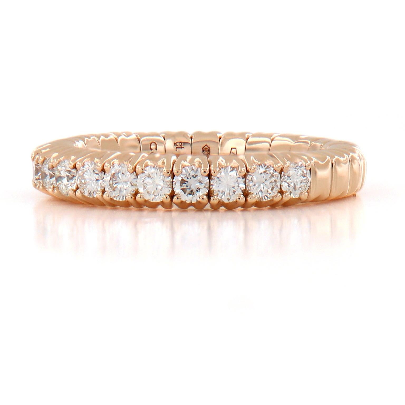 Made in Italy for Campanelli & Pear this beautiful stretchable diamond band ring is designed for comfort and perfectly fits one’s finger. It even fits those with larger knuckles! The ring is crafted in 18k rose gold and features 17 round brilliant