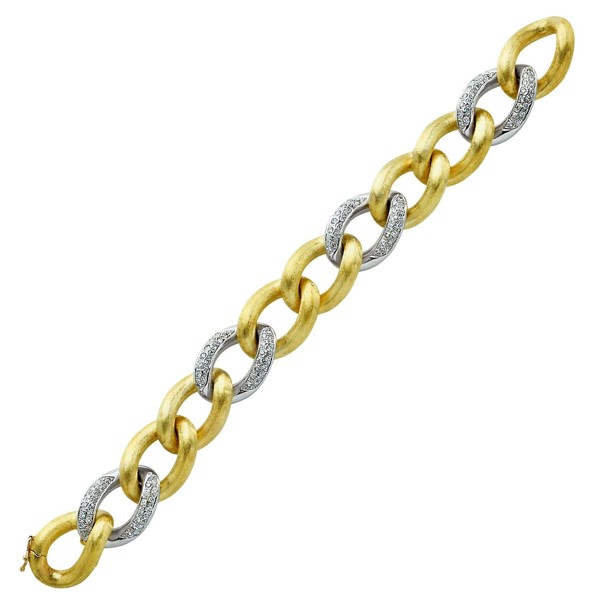 Crafted in Italy this bracelet is manufactured superbly, with great a heft, stunning textural quality and gleaming diamonds. Set in 18 karat two tone gold. The bracelet is adorned with 112 round brilliant cut diamonds, G color, VS1-2 clarity. This