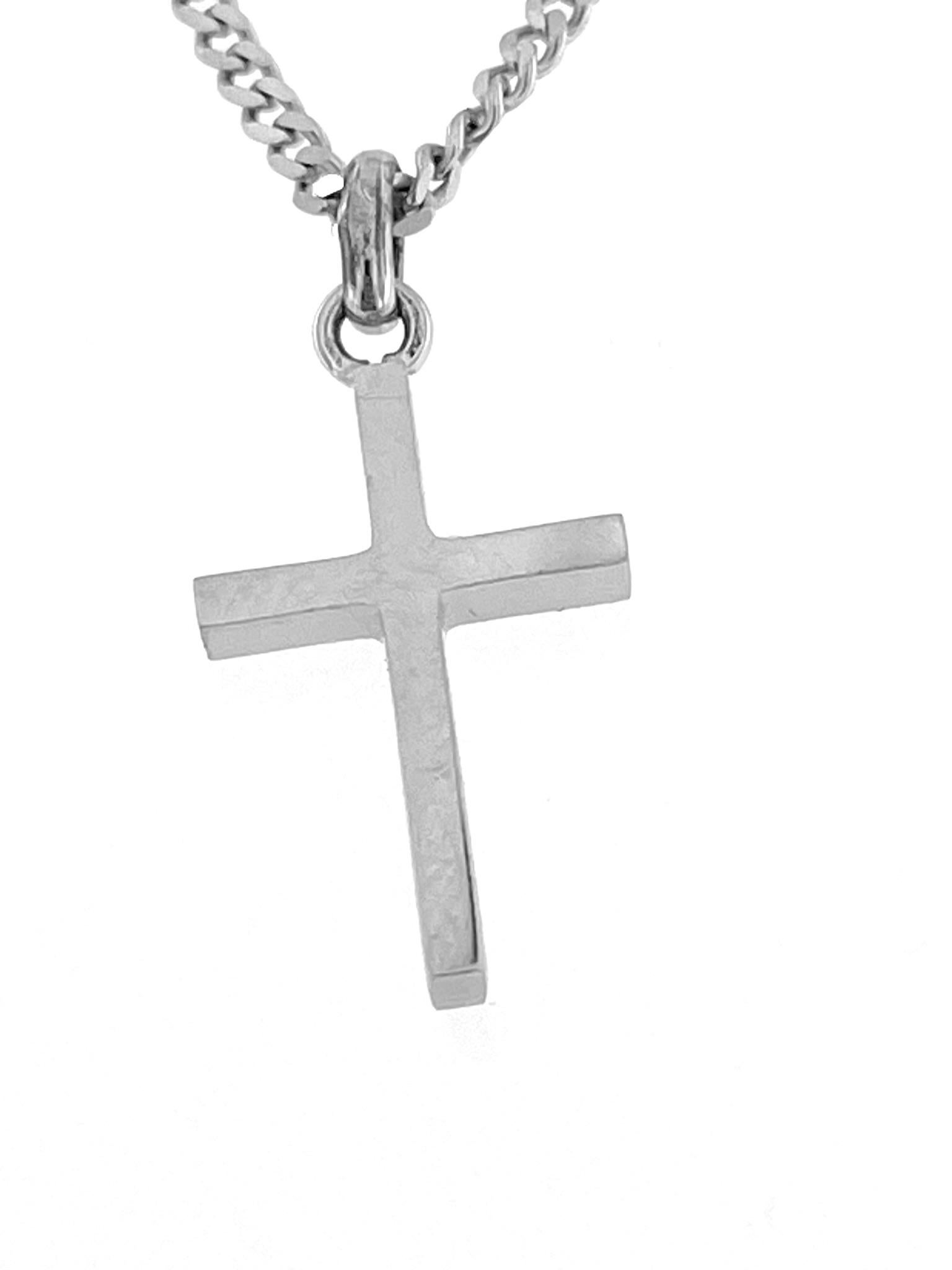 The Italian 18-karat White Gold Cross with Chain by Chini is an exquisite piece of religious jewelry crafted with precision and artistry. This cross necklace is designed and produced by Chini, an Italian jewelry brand known for its fine