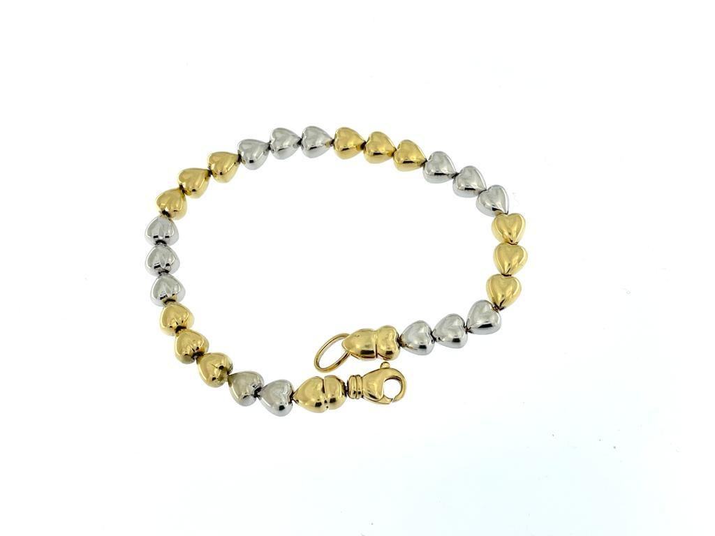 This Italian-made bracelet is a masterpiece of craftsmanship and design, showcasing the renowned artistry of Italian jewelry. Crafted from high-quality 18 karat yellow and white gold, the bracelet exudes a luxurious and sophisticated charm.

The