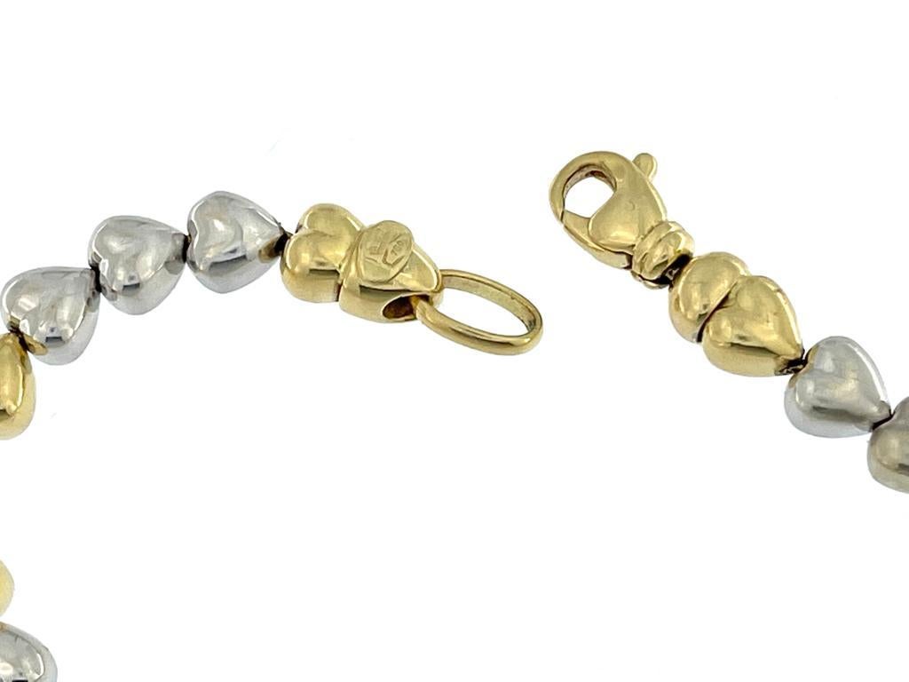 Contemporary Italian 18 karat Yellow and White Gold Hearts Bracelet For Sale
