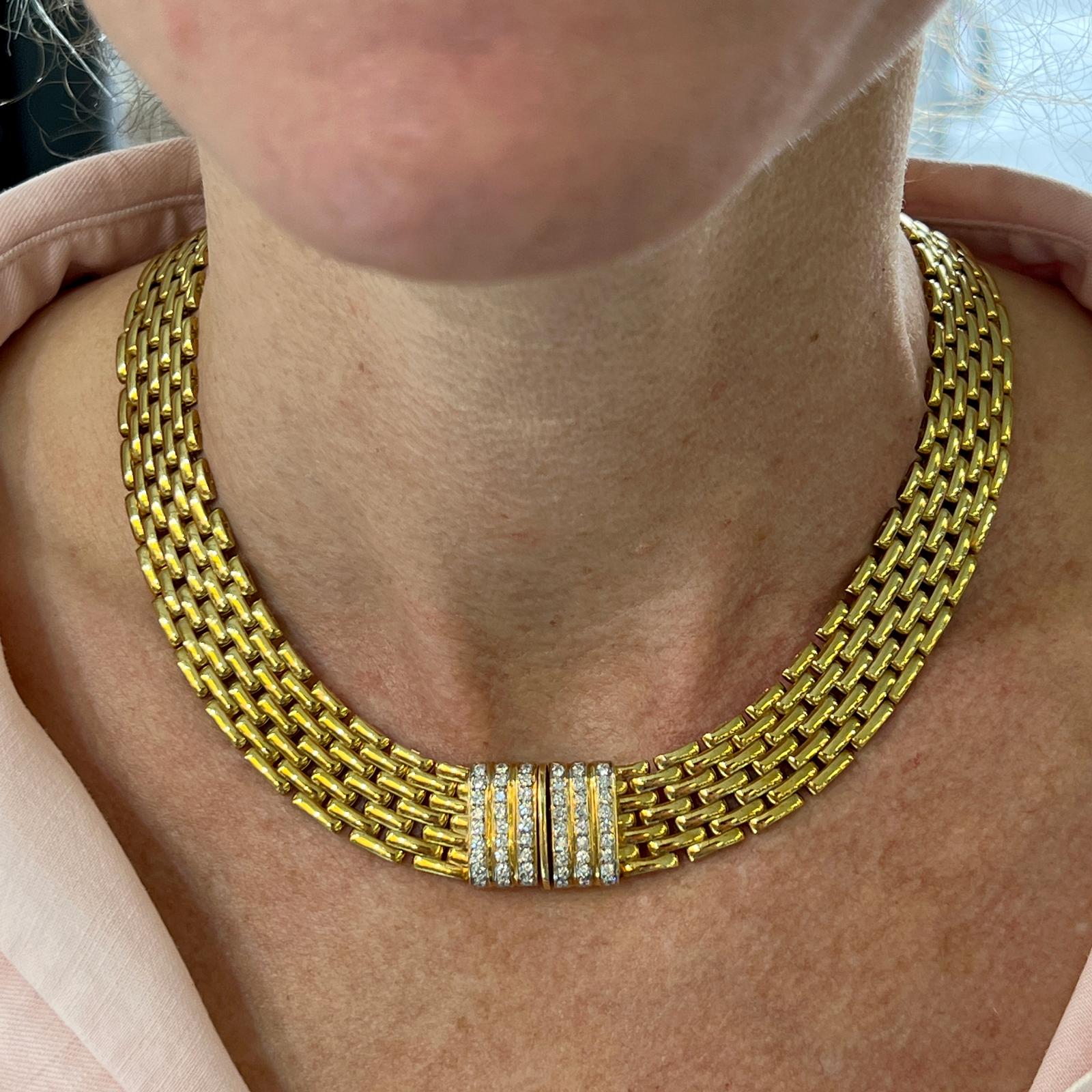 Beautiful and timeless panther link necklace crafted in 18 karat yellow gold. The necklace features 7 rows of panther links measuring 15 inches in length, and 15mm in width. The diamond clasp is set with 54 round brilliant cut diamonds weighing