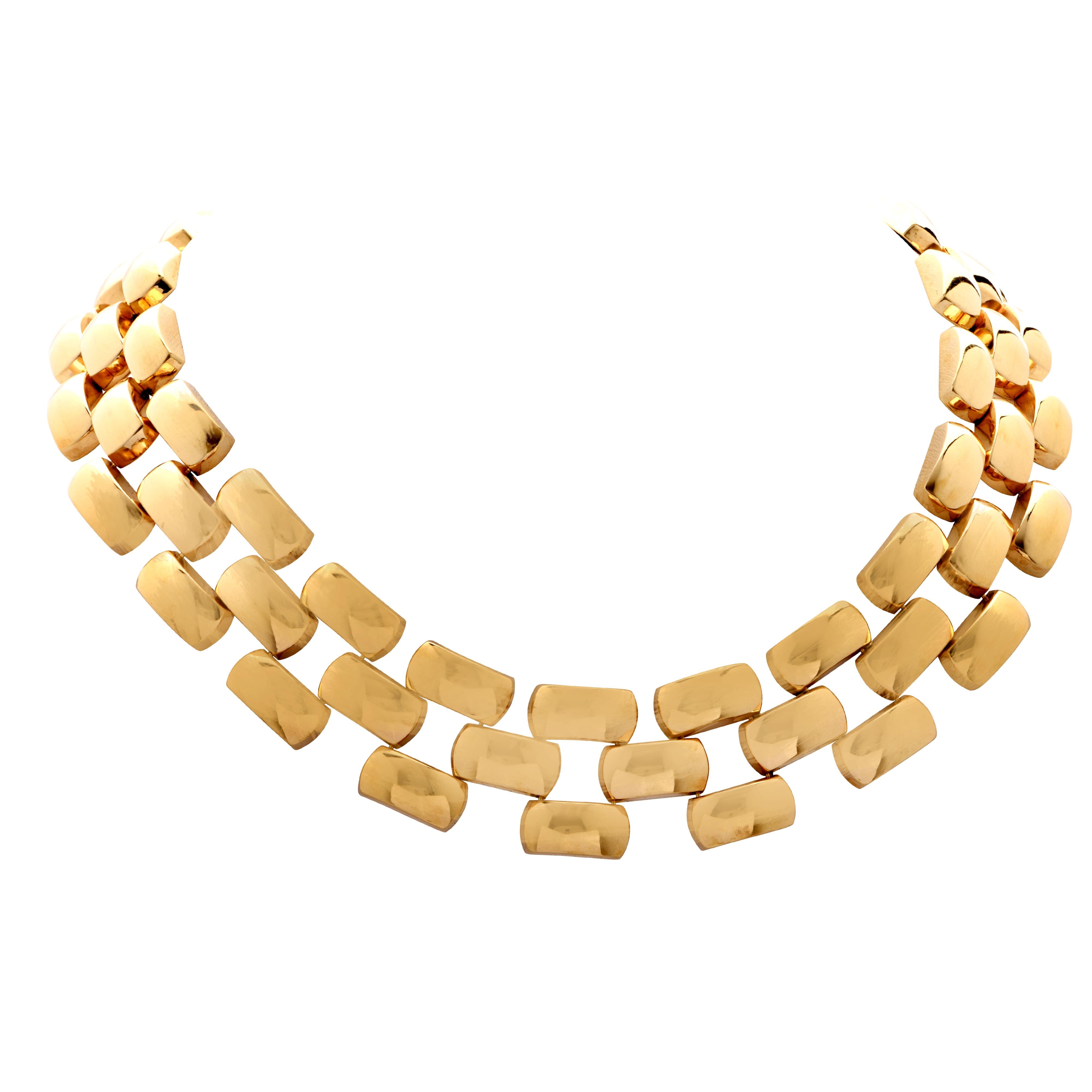 Striking 18 Karat yellow gold necklace made in Italy. Feel the smooth, silkiness of this necklace as it embraces and wraps luxuriously around your neck.  This elegant necklace measures over 1 inch in width and 18 inches in length. It weighs 103.4