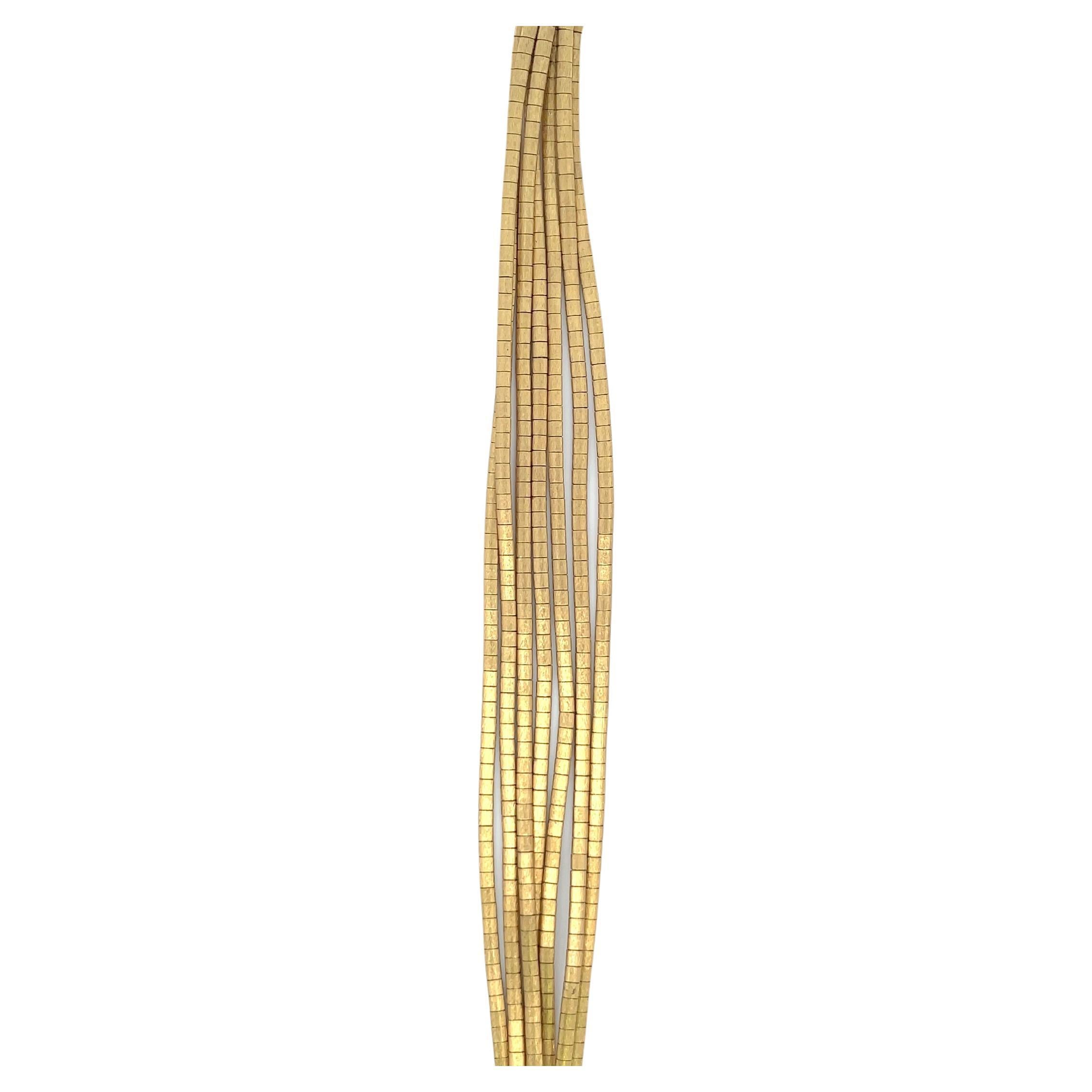 Made in Italy, this 18 karat yellow gold bracelet features 7 multi textured strands weighing 48.3 grams.
Each strand is 2.5 mm wide
Feels like silk! 

Search Harbor Diamonds for more gold link bracelets.
