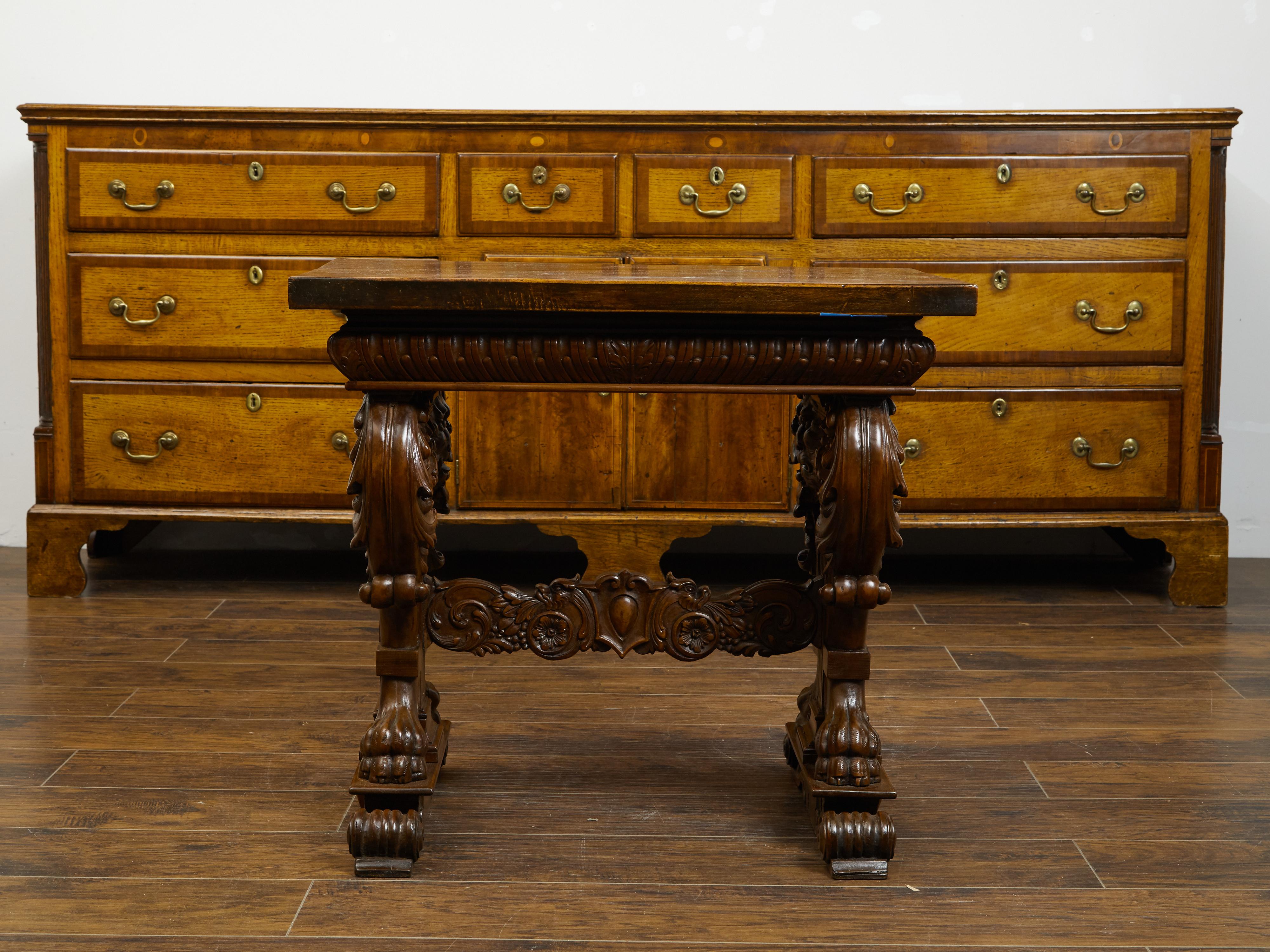 Italian 1800s Walnut Side Table with Lion Motifs and Richly Carved Trestle Base For Sale 6