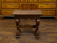 Italian 1800s Walnut Side Table with Lion Motifs and Richly Carved Trestle Base