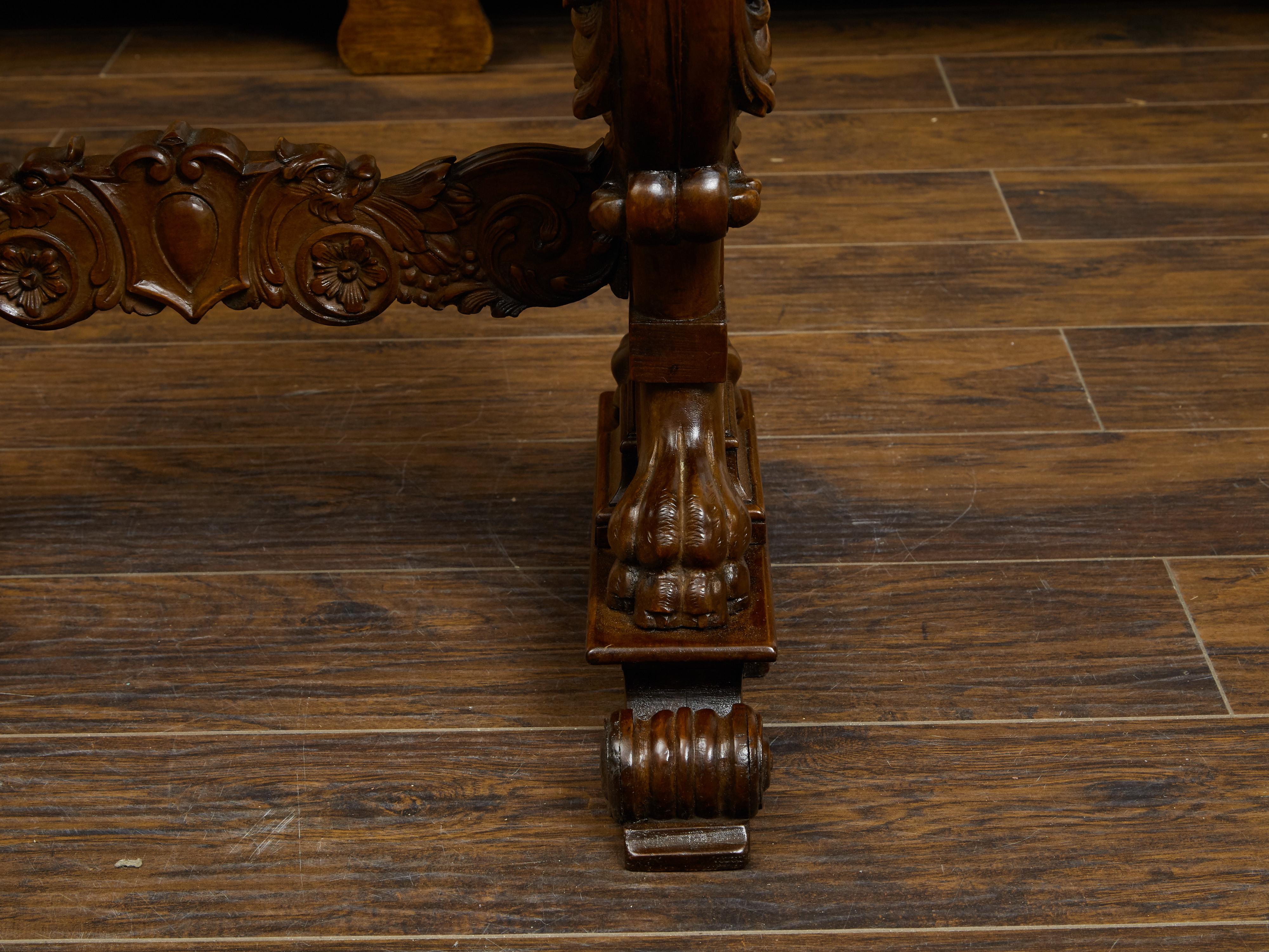 Italian 1800s Walnut Side Table with Lion Motifs and Richly Carved Trestle Base In Good Condition For Sale In Atlanta, GA