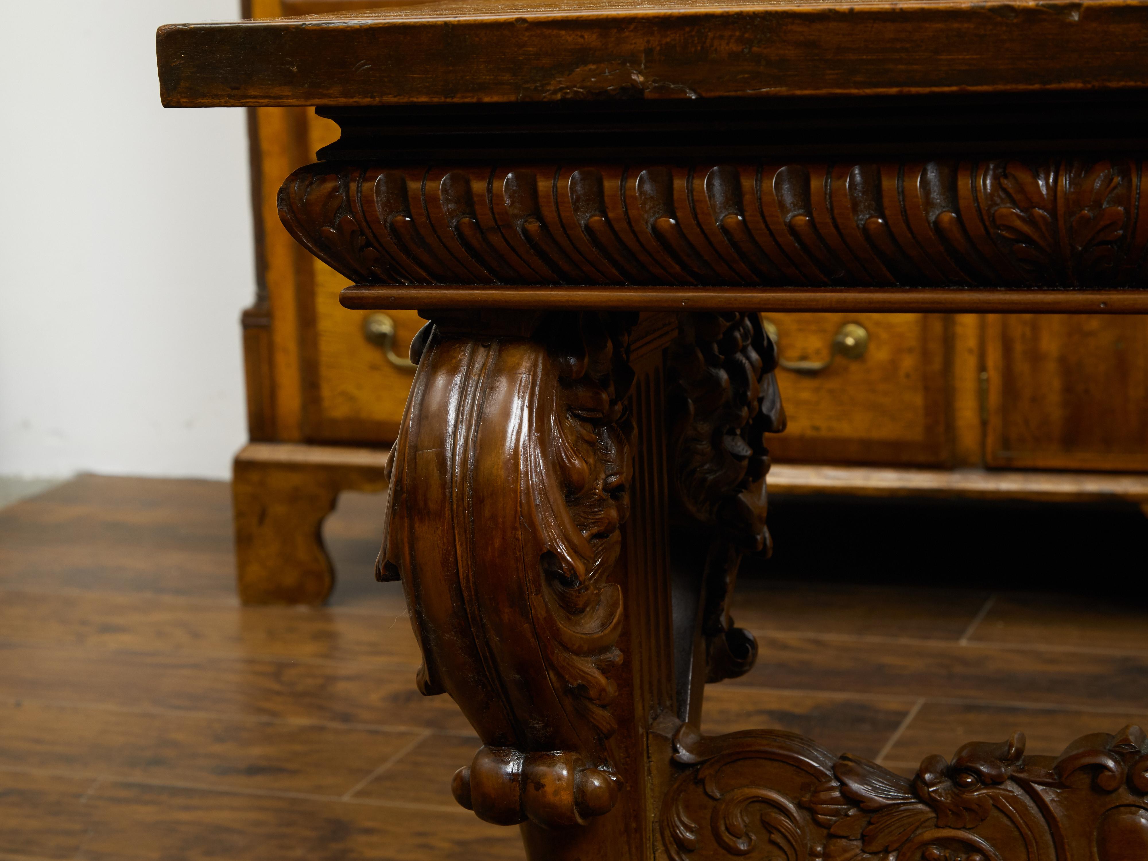 Italian 1800s Walnut Side Table with Lion Motifs and Richly Carved Trestle Base For Sale 1