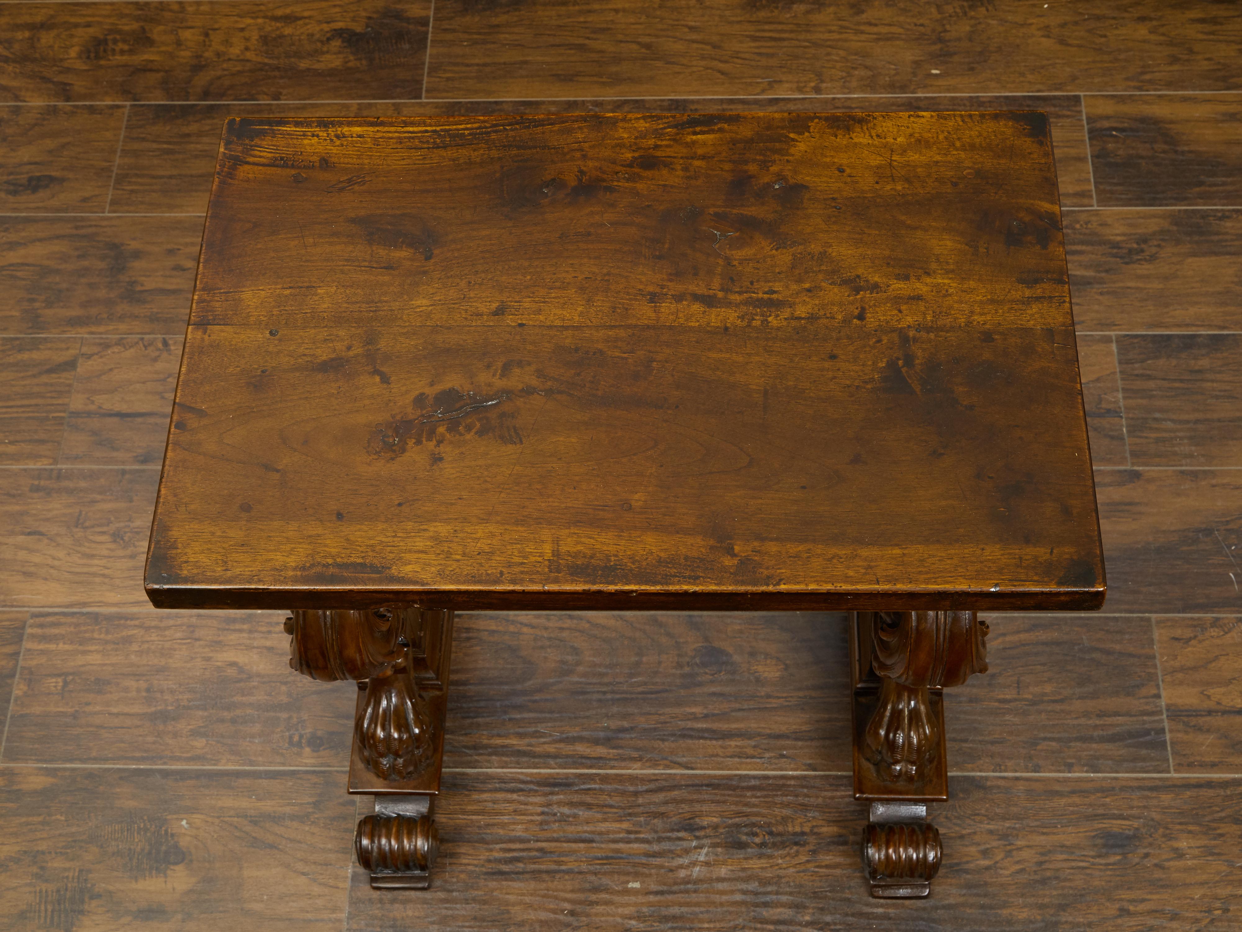 Italian 1800s Walnut Side Table with Lion Motifs and Richly Carved Trestle Base For Sale 2