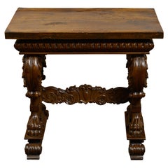 Antique Italian 1800s Walnut Side Table with Lion Motifs and Richly Carved Trestle Base