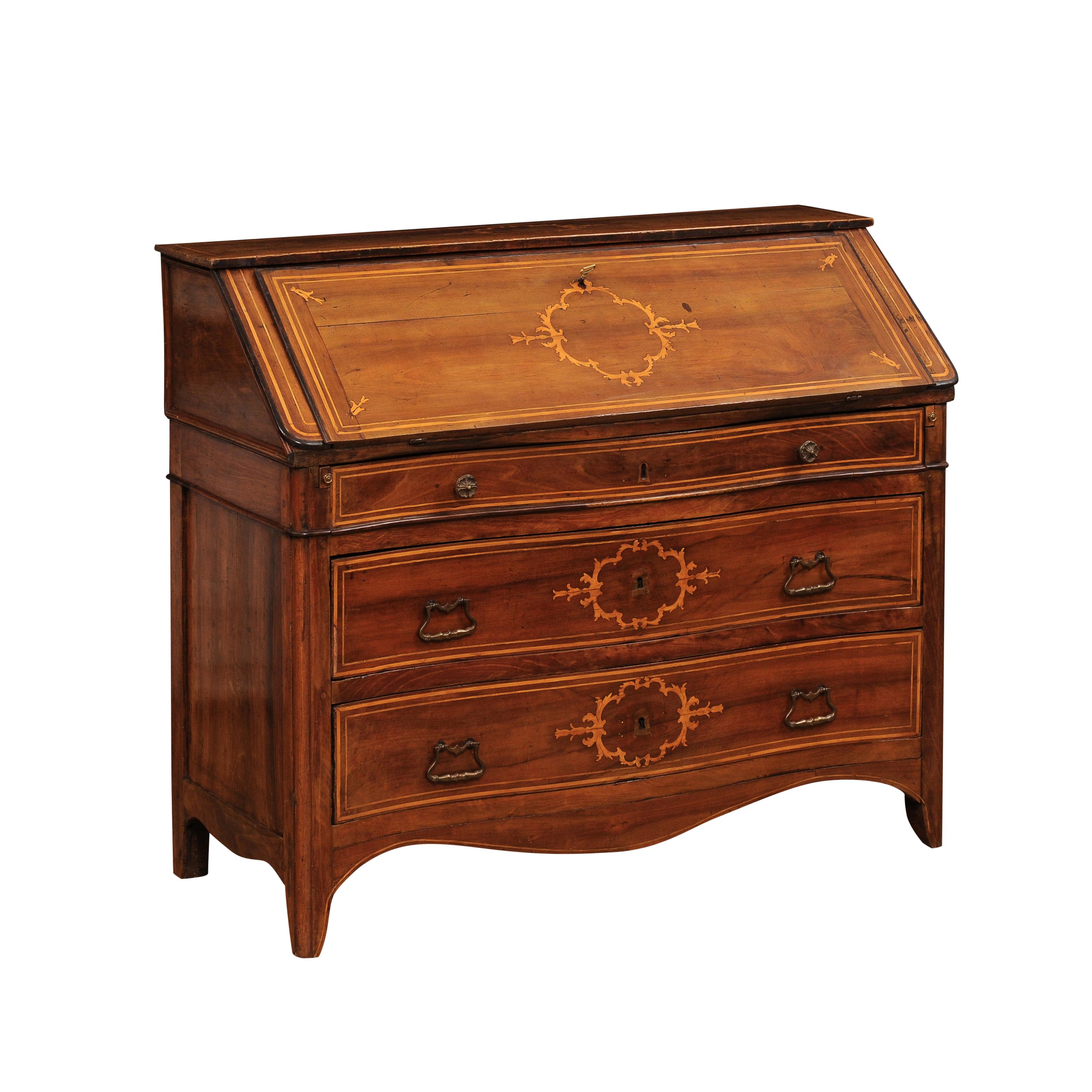 An Italian walnut and maple slant front desk, circa 1820 with marquetry décor and three graduating drawers. Immerse yourself in the elegance of Italian craftsmanship with this, circa 1820 walnut and maple slant front secretary. Expertly crafted with