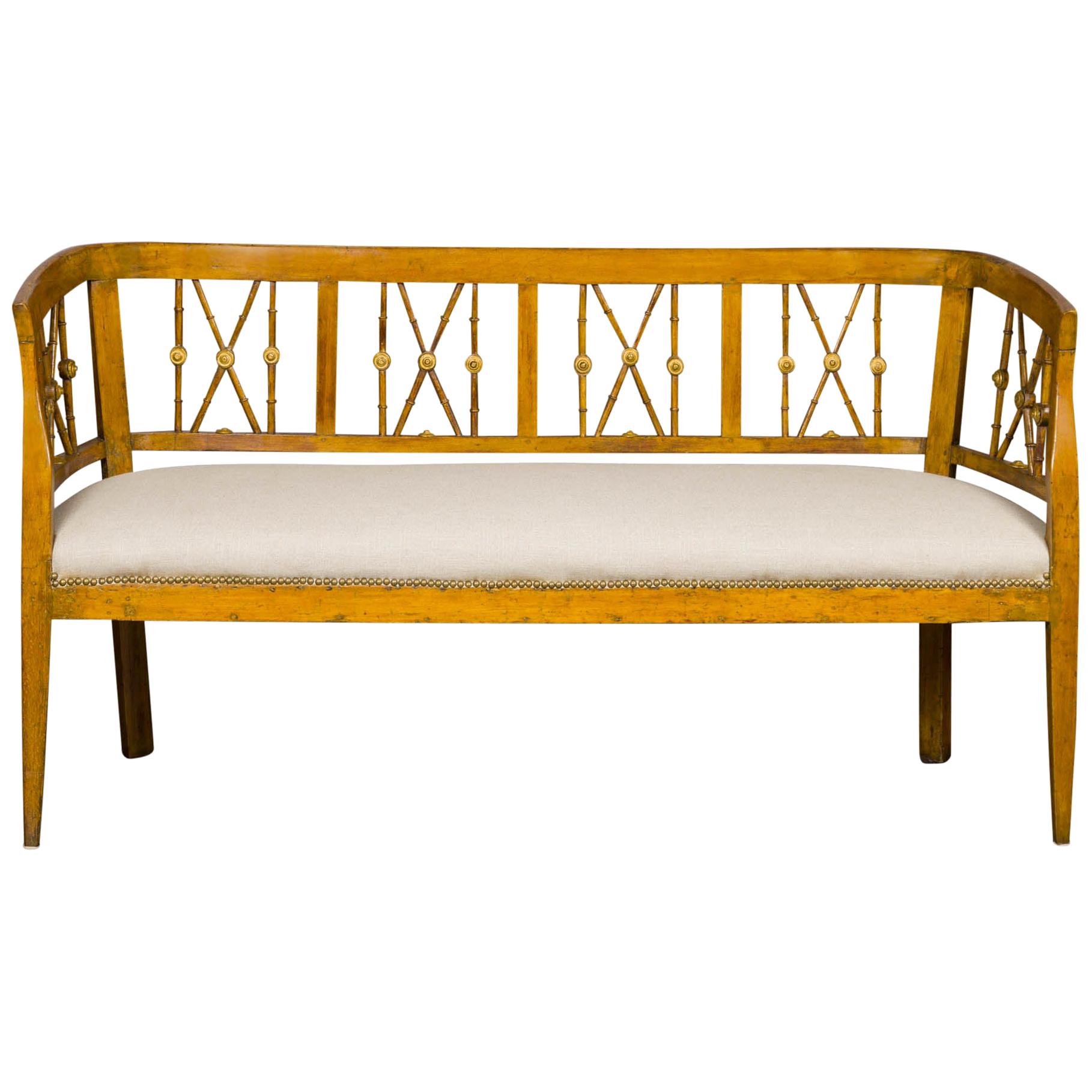 Italian 1820s Walnut Settee with Pierced Back, X Motifs and Gilded Medallions