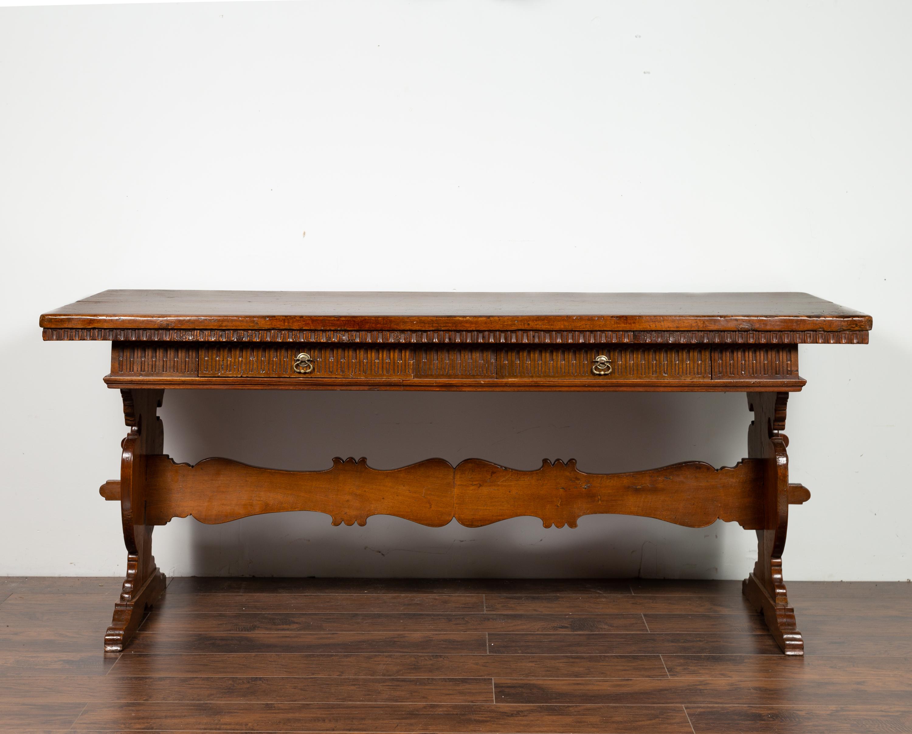 Italian 1840s Walnut Trestle Table with Two Drawers and Fluted Accents In Good Condition In Atlanta, GA