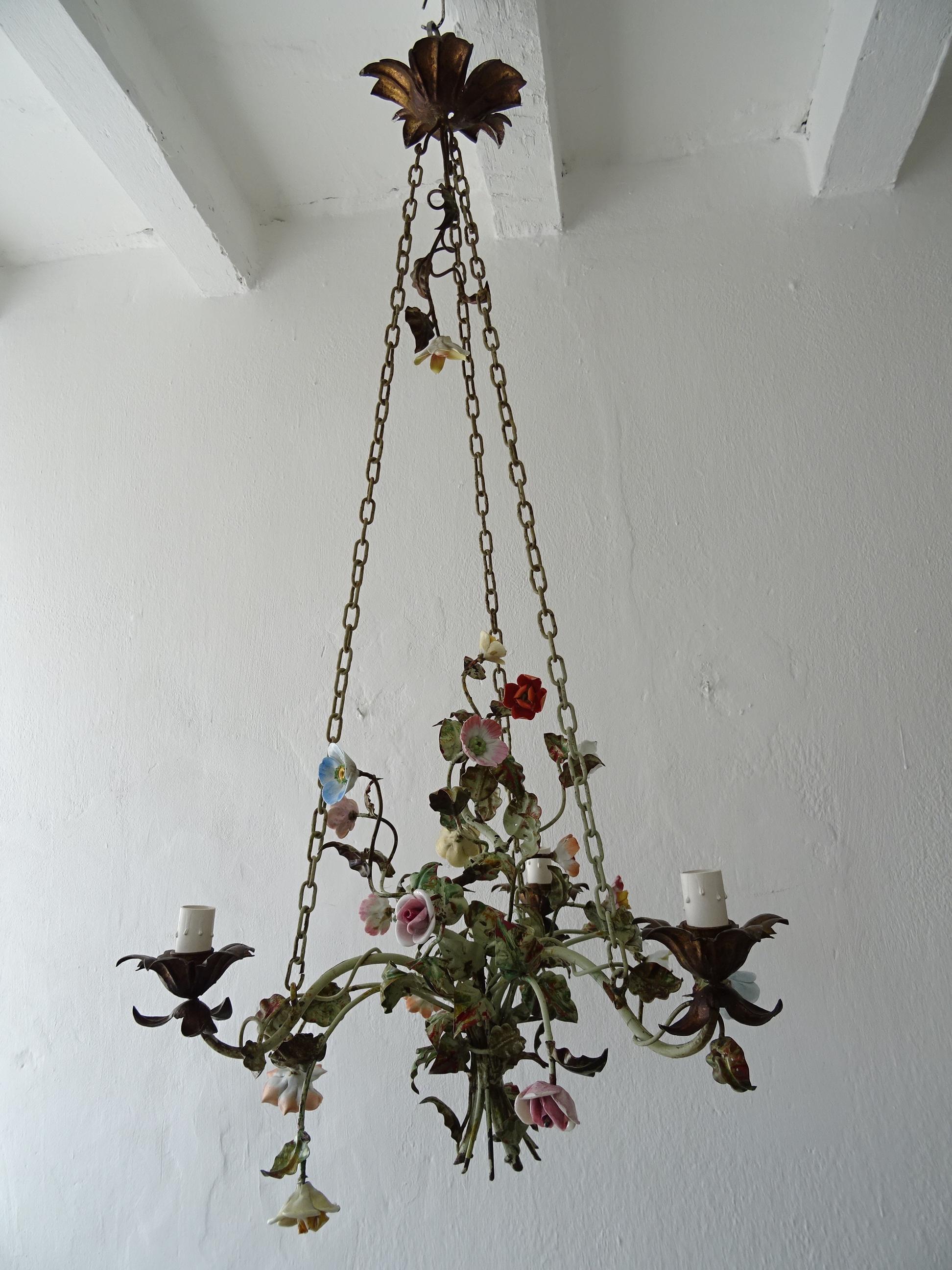 Housing 3 lights. Will be rewired with certified UL US sockets for the USA and appropriate sockets for other countries and ready to hang. Red and green chippy tole leaves. Handmade porcelain flowers, some may have flea bites. Rare chains with a