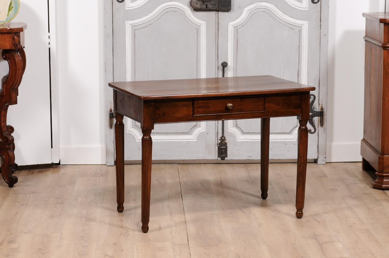 An Italian walnut side table from circa 1890 with elm star marquetry, single drawer and turned legs. This Italian walnut side table, hailing from the elegant period of circa 1890, boasts a splendid display of craftsmanship and design. The tabletop