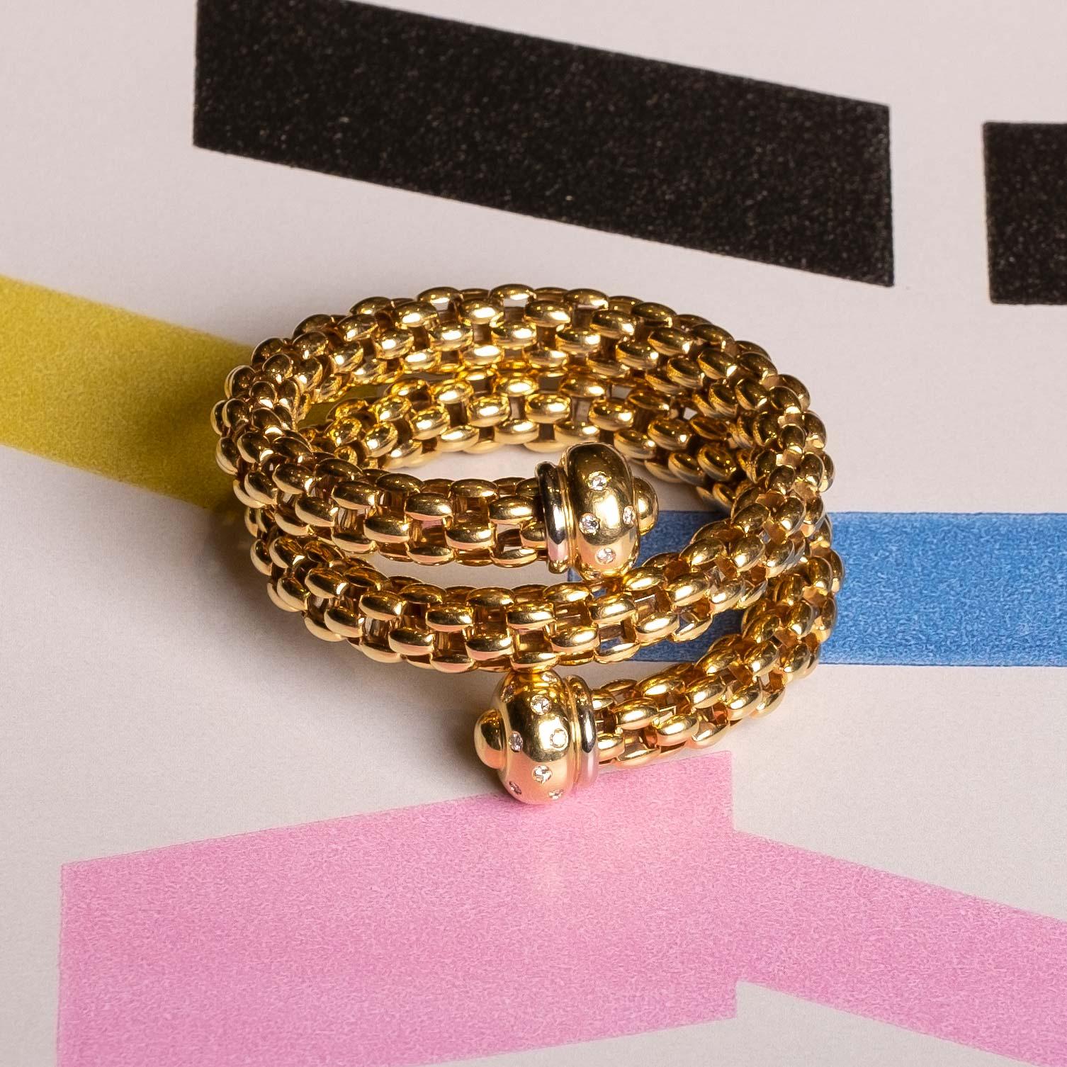 Vintage wrap bracelet in 18 carat gold and diamonds signed FOPE. Made in the 