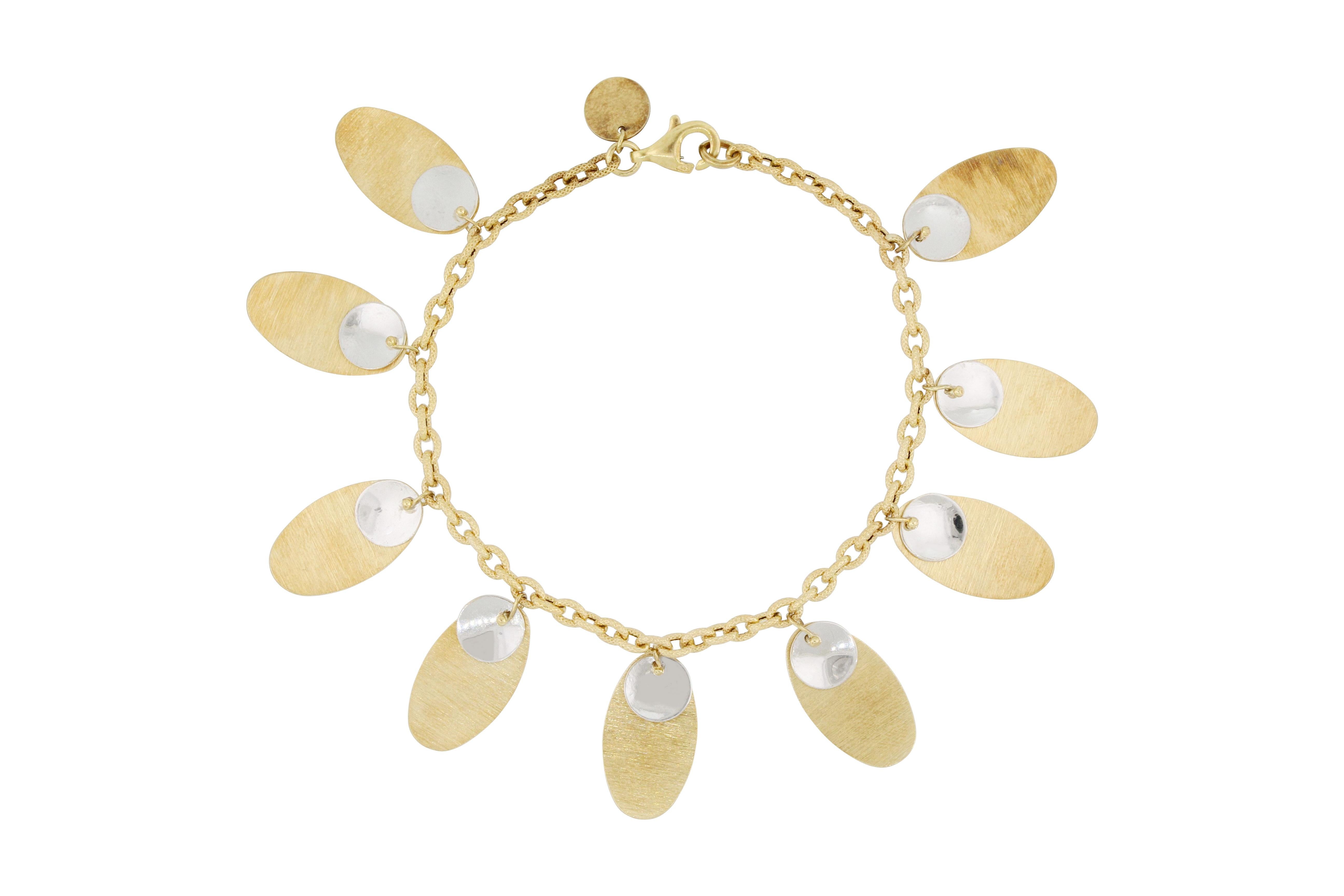 A very nice 18K gold bracelet designed and made in Italy, decorated with dangling bicolour charms in oval shape, it’s stylish and trendy.
The company is renowned for its high jewellery collections with fabulous designs. Our designs reflect the