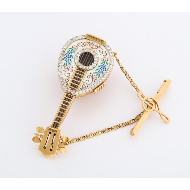 An Italian 18K Gold, Enamel, And Diamond Mandolin Pendant Watch Brooch Box, by G. Ferrero,  Gorgeous quality brooch, in the form of a musical mandolin with hidden watch. Finley enameled and set with diamonds.   0.5