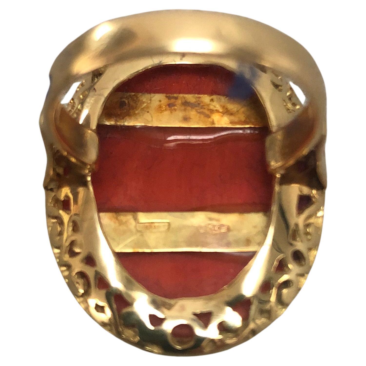 Stunning large natural oval coral set in 18 karat gold, one of kind ring. Ring size about 6.75 coral 1.18 inch by 0.78, total weight 9.78 grams.