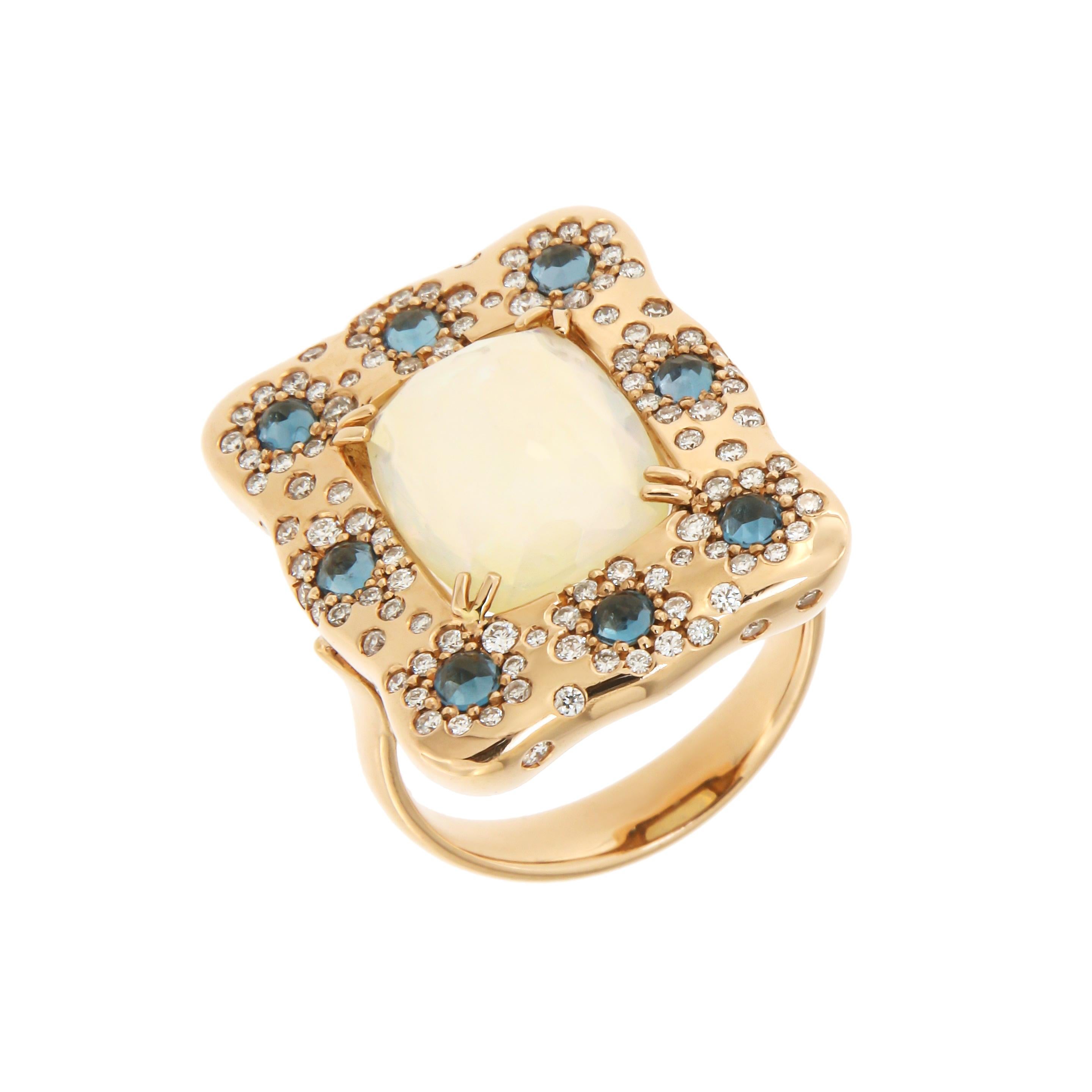 Ring Rose Gold 18 K 
Diamond 0,73 ct
London Blue Topaz 
Opal

Weight 10.8 grams
Size 14

With a heritage of ancient fine Swiss jewelry traditions, NATKINA is a Geneva based jewellery brand, which creates modern jewellery masterpieces suitable for