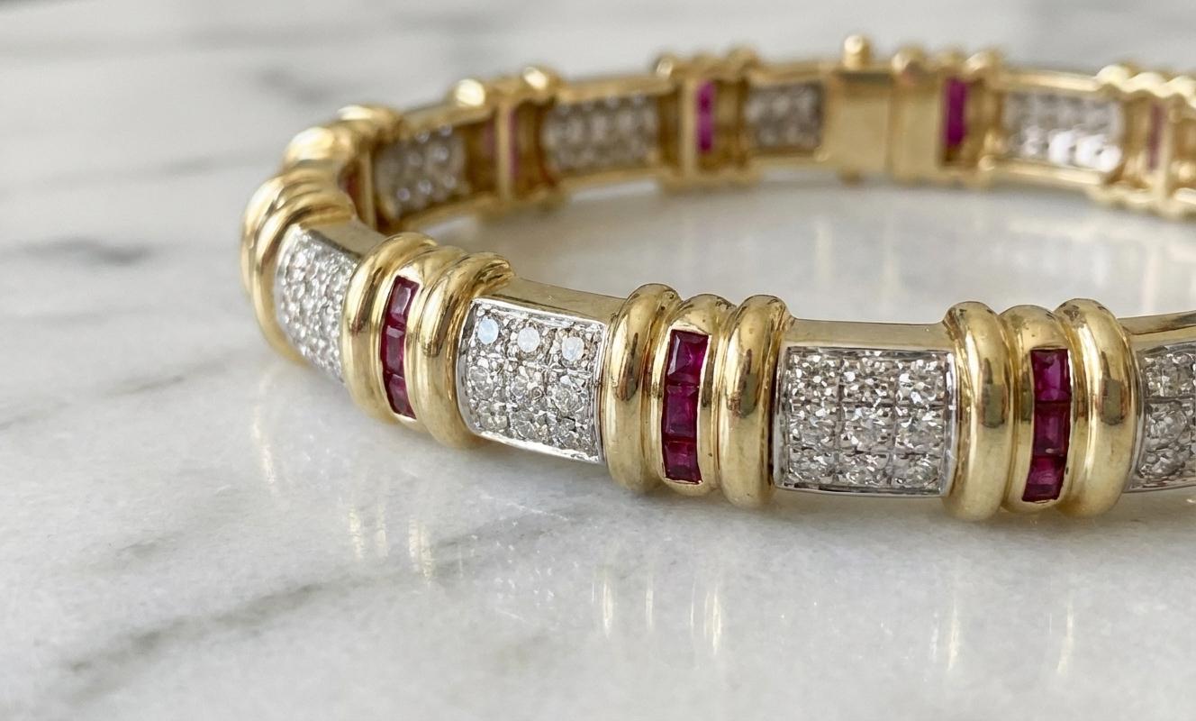 This elegant Italian bangle bracelet is finely crafted in 18k two-tone gold, blending warm yellow gold with polished white gold for a refined and luxurious appearance. Designed with a bold geometric rhythm, the bracelet alternates pavé diamond