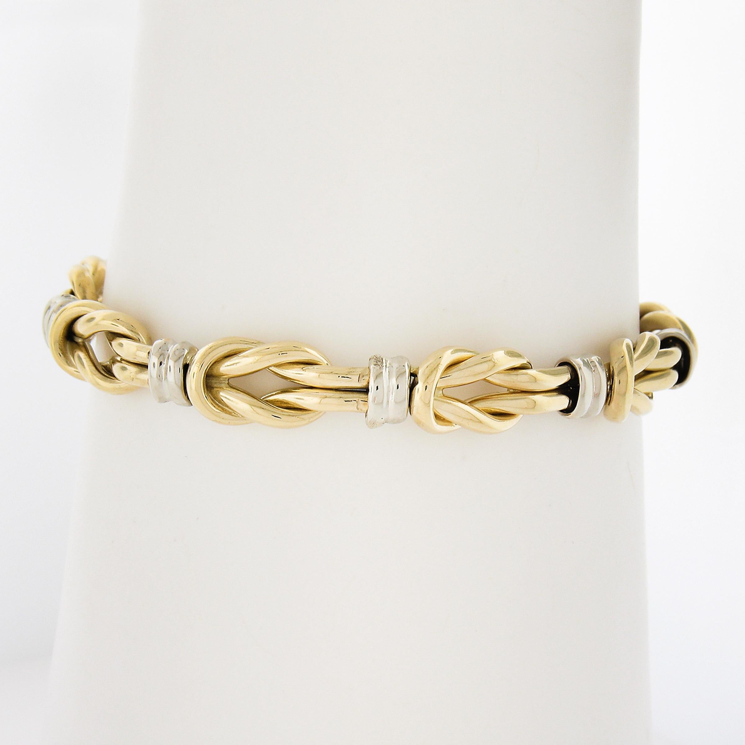 MATERIAL: Massives 18k Gelb- und Weißgold 
Gewicht: 21,56 Gramm
Länge: Passt bequem bis zu einem Handgelenk von 6,5 Zoll (an einem Handgelenk angebracht)
Verschluss: Box Clasp mit Sicherheitsverriegelung
Breite: 7,5 mm (0,29