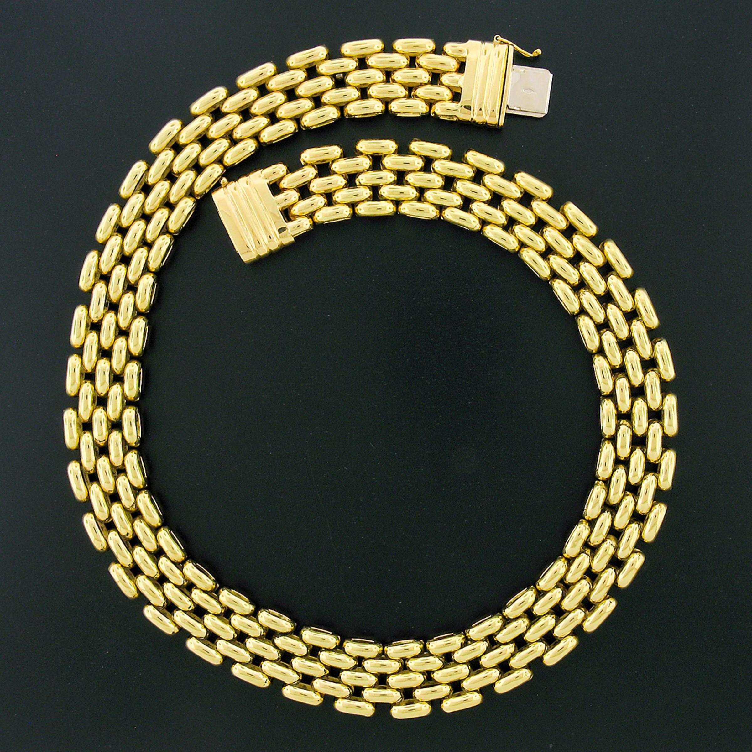 This incredible necklace was crafted in Italy from solid 18k yellow gold and features a wide panther link design with a nice high-polished finish throughout. The chain measures 17.75 inches in wearable length and elegantly lays around the neck with