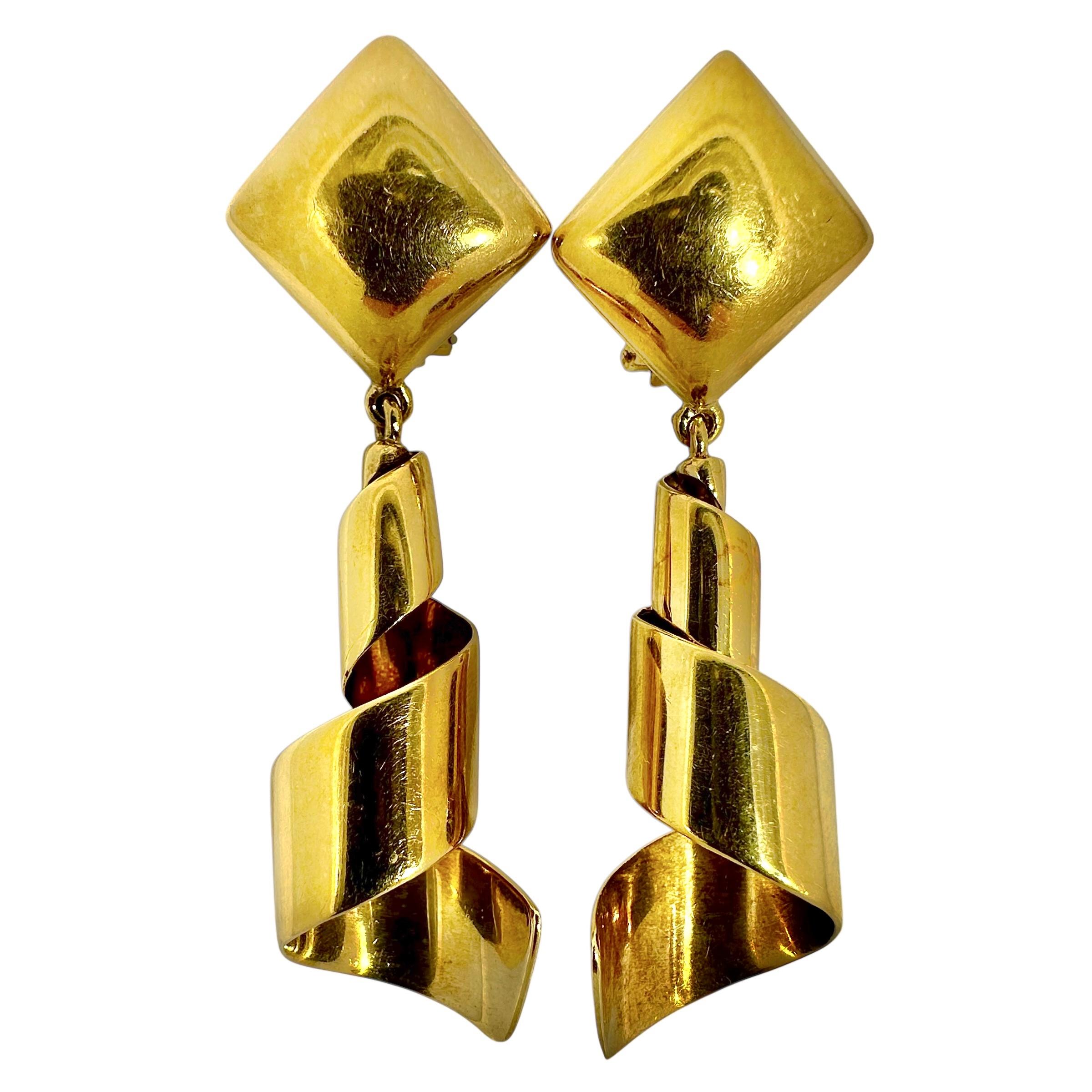 This pair of vintage, Italian, 18K yellow gold corkscrew earrings measure almost 2 3/4 inches in length, making them impossible to miss by any casual observer. Width at the top is 3/4 inch and at the bottom is 5/8 inch. Tops and corkscrew bottoms