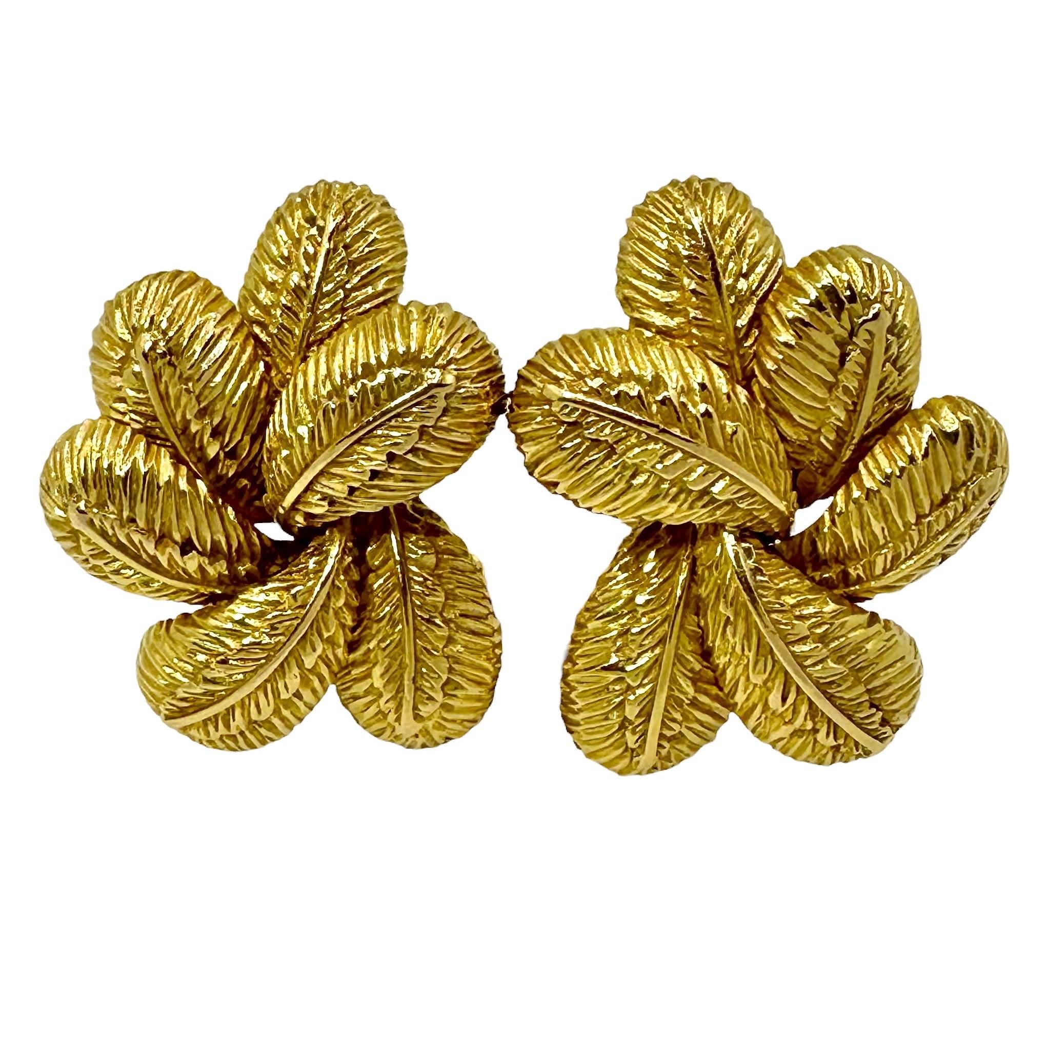 This characteristically Italian pair of richly burnished 18K yellow gold clip on earrings create a gentle sense of motion. Every surface is deeply textured. The tailored style makes them ideal for every day use.  Measures 1 1/8 inches long by just