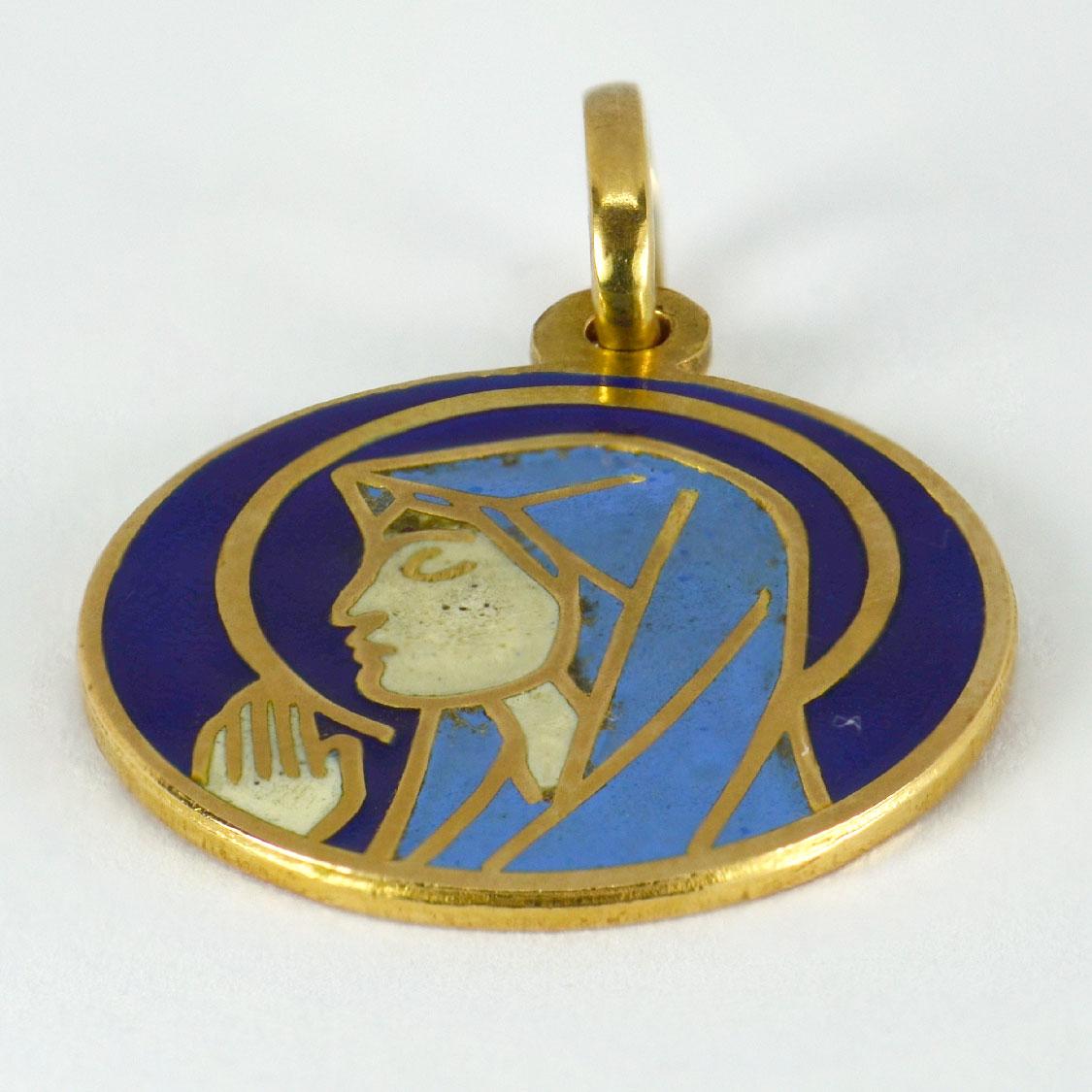 An Italian 18 karat (18K) yellow gold charm pendant designed as a medal depicting the Virgin Mary with blue enamel detail. Stamped with Italian marks and 750 for 18 karat gold.

Dimensions: 2.4 x 2.1 x 0.15 cm (not including jump ring)
Weight: 5.42