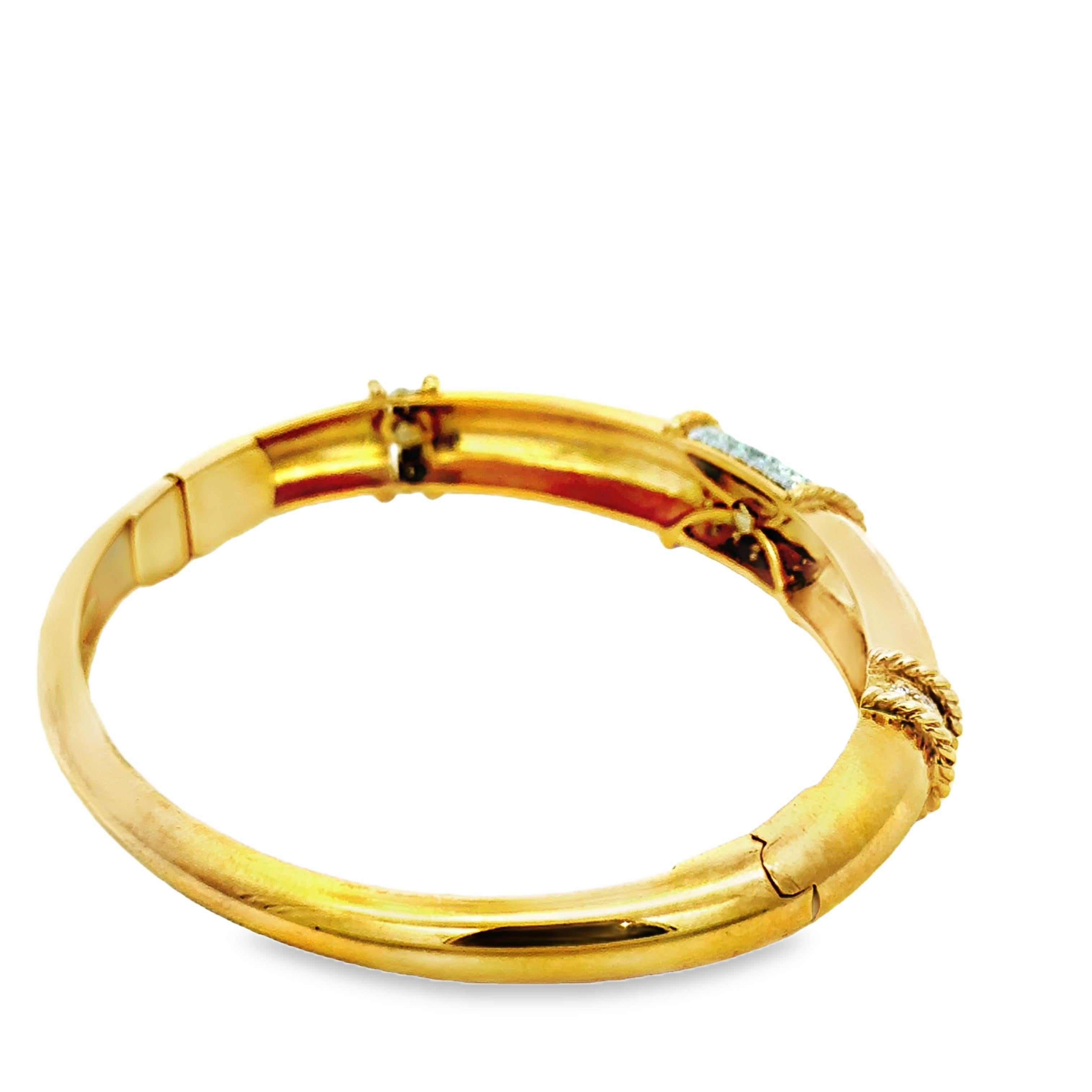A refined vintage Italian bangle bracelet, crafted in luxurious 18 karat yellow gold and weighing an impressive 37 grams. This hinged bracelet showcases a bold central panel of pavé-set round brilliant diamonds totaling approximately 1.11 carats,