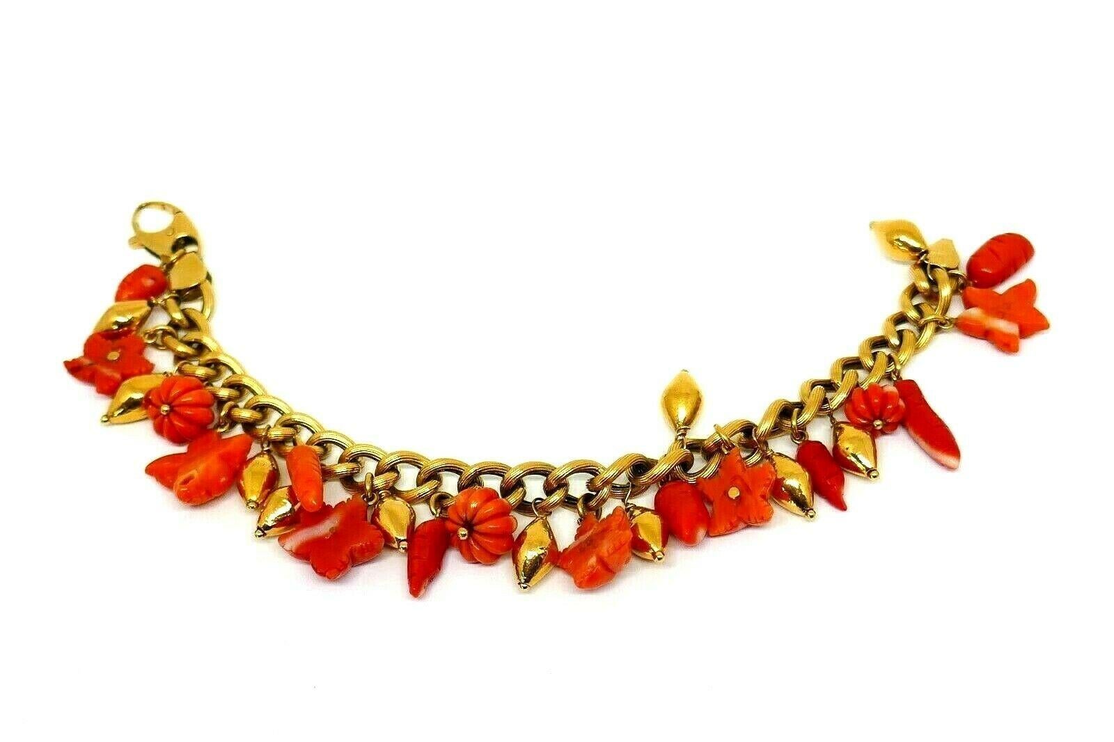 Cheerful, bright and lightweight, this trendy bracelet is the best for layering or wearing by itself.  Features gold drop beads and Mediterranean coral charms.
Will fit medium size wrist. Stamped with Italian mark and a hallmark for 18k gold.