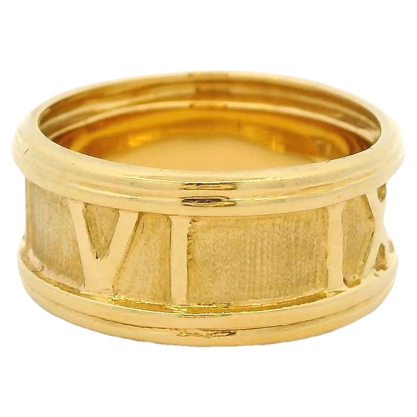 Anello a fascia con numeri romani in oro giallo 18 carati