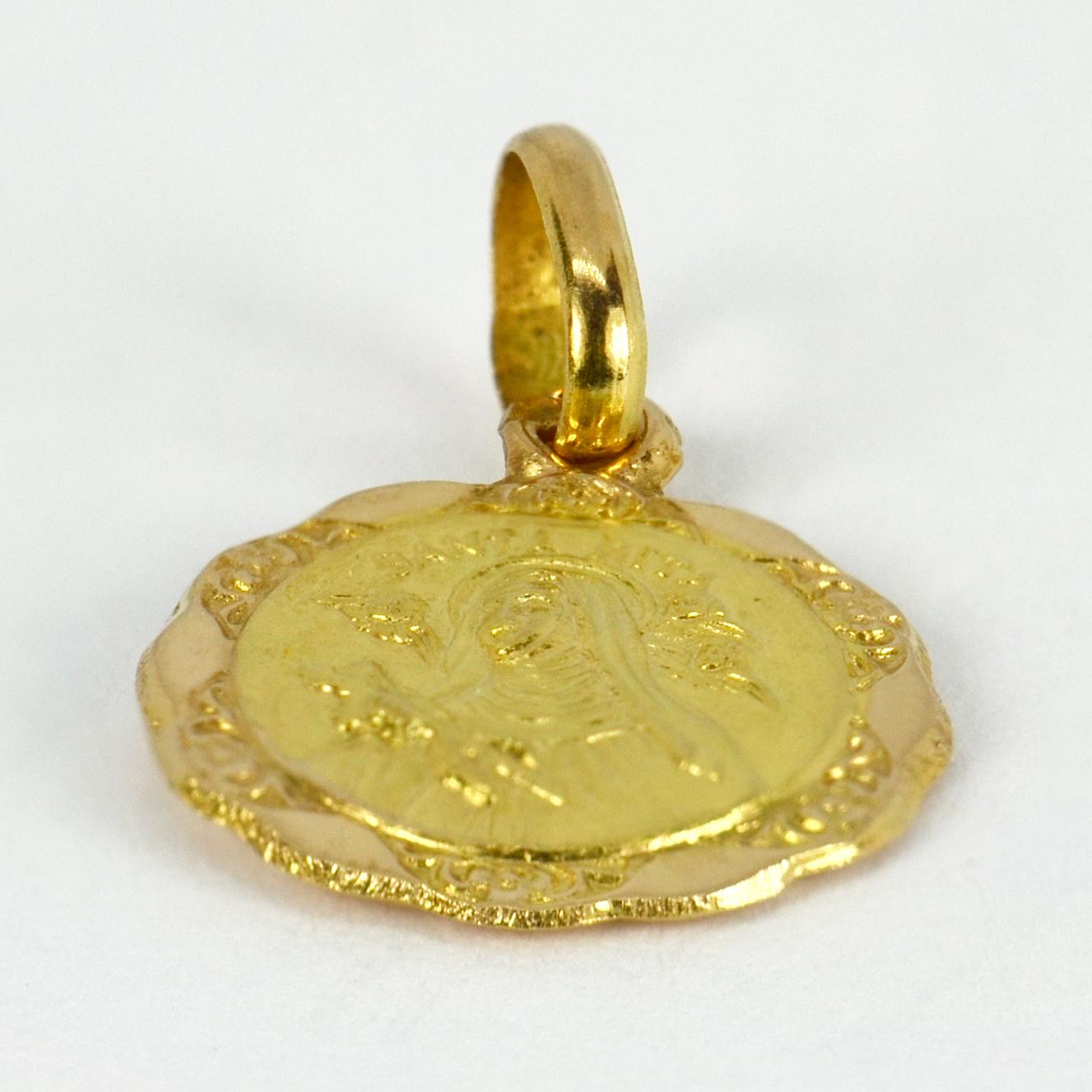 An Italian 18 karat (18K) yellow gold charm pendant designed as a medal depicting Saint Rita holding a crucifix and surrounded by cherubs. Saint Rita is known as the Patroness of Impossible Causes, and in many Catholic countries is considered to be