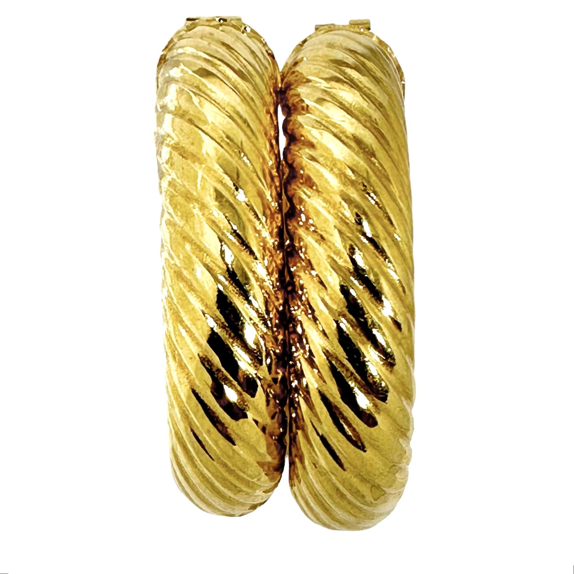 This wonderful pair of Italian 18k yellow gold hollow puffed hoop earrings are large but not overbearing. They demonstrate all of the style and quality for which Italian goldsmiths are admired. They measure 1  1/4 inches in length by  1  1/8 inches