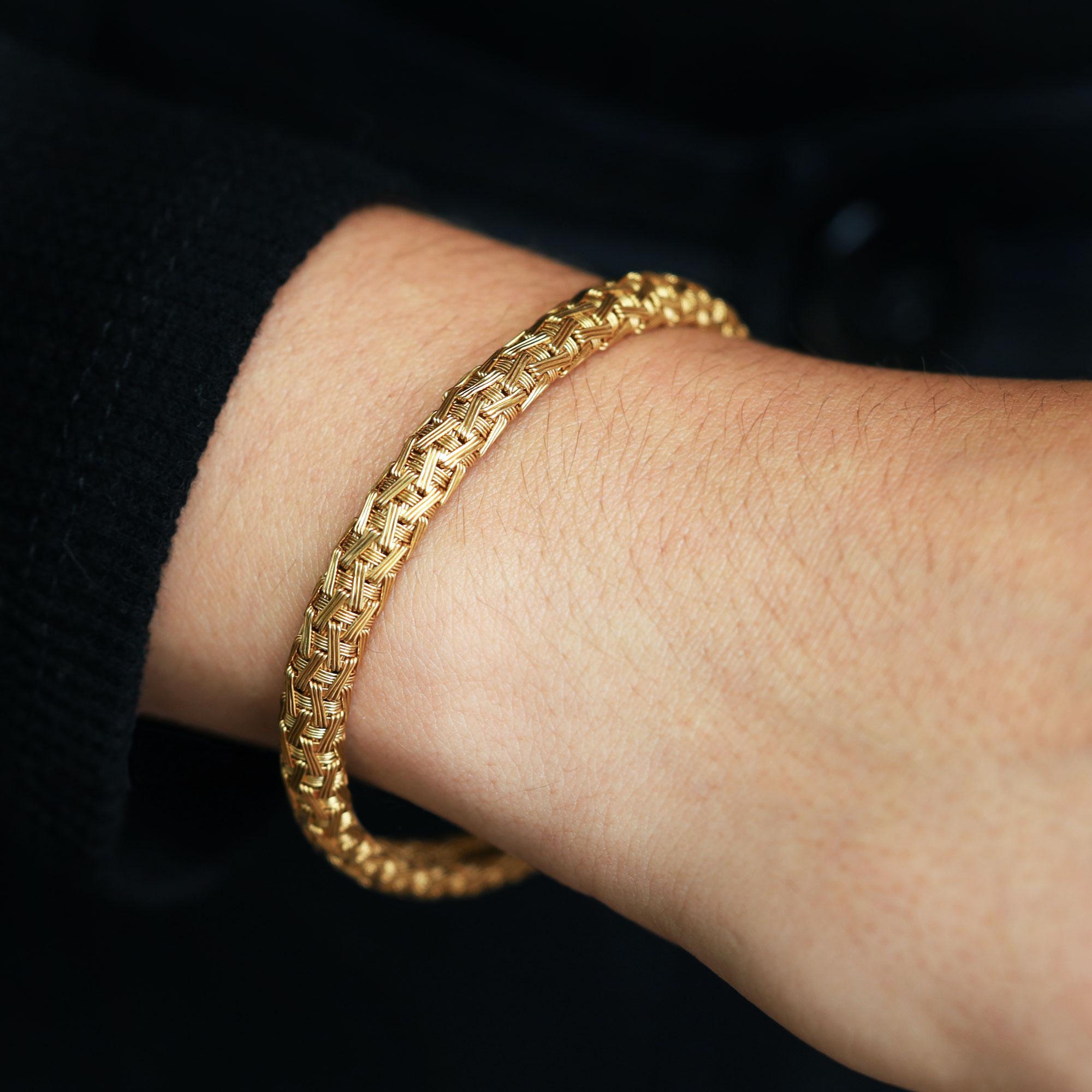 A special vintage estate treasure, this fancy woven bombé style bracelet it the finest in sustainability, and remains in excellent condition. The luxurious Italian design perfectly pairs with your favorite gold jewels, and stacks effortlessly with