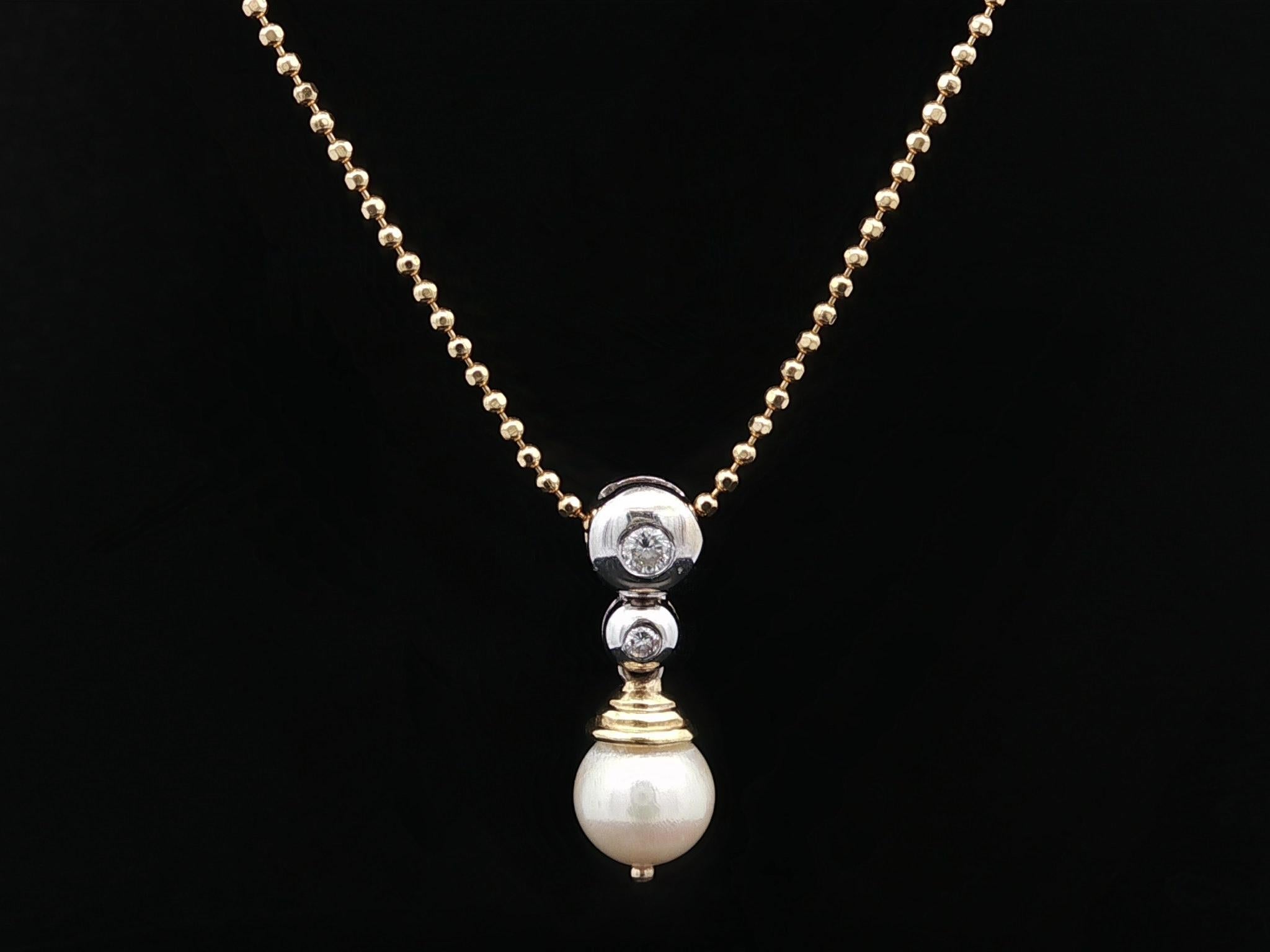 --Stone(s):--
(1) Genuine Cultured Pearl - Round Bead Shape - Cream Color - 6.9mm (approx.)
(2) Natural Genuine Diamonds - Round Brilliant Cut - Burnish Set - White Diamonds - 0.07ctw (approx.)

Material: Solid 18k Yellow & White Gold
Weight: 4.5