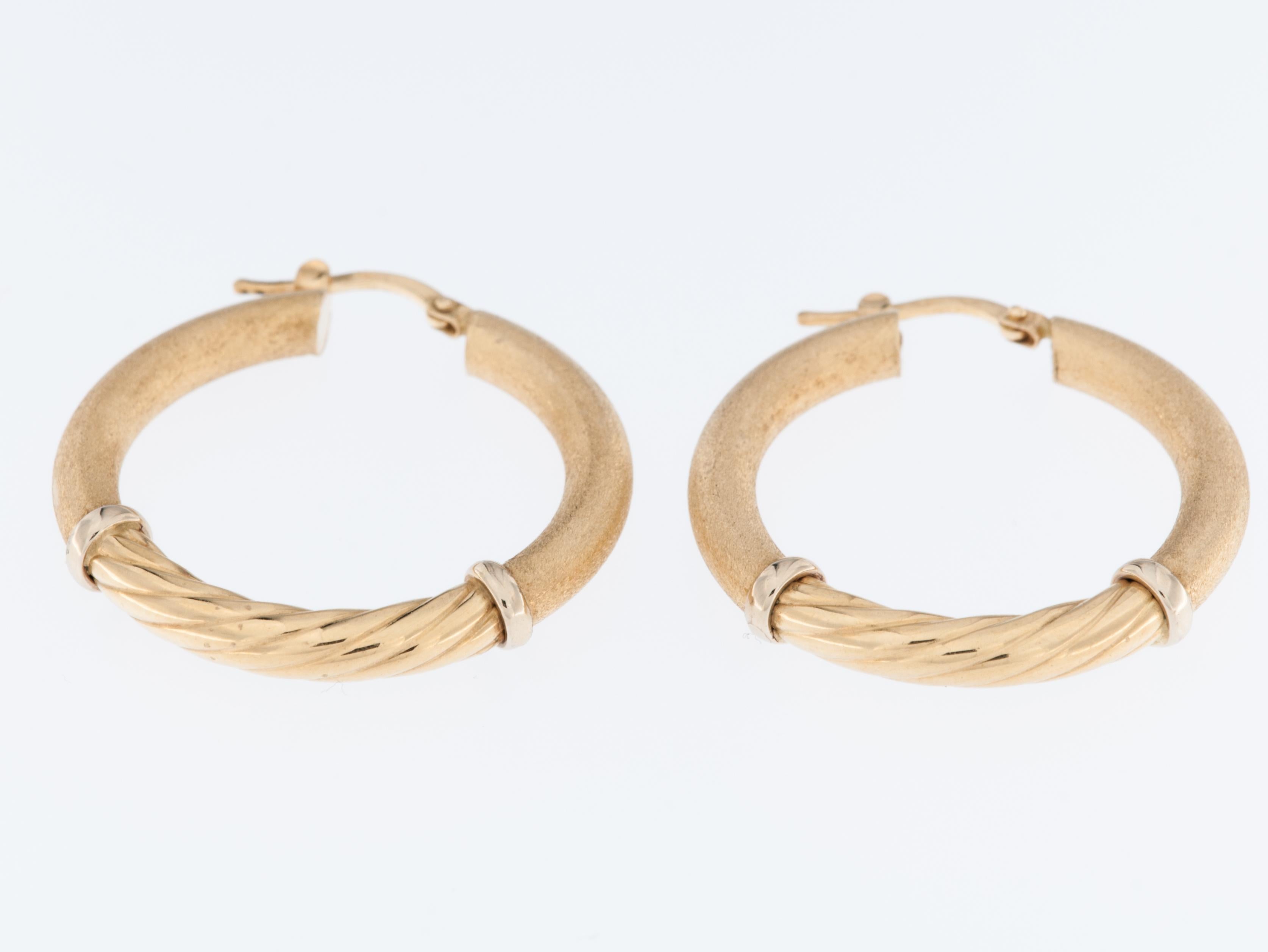 These Italian 18kt Yellow Gold Hoop Earrings are a stunning and elegant accessory that exudes timeless beauty. Crafted from high-quality 18-karat yellow gold, these earrings showcase a luxurious and lustrous metal that adds a touch of sophistication