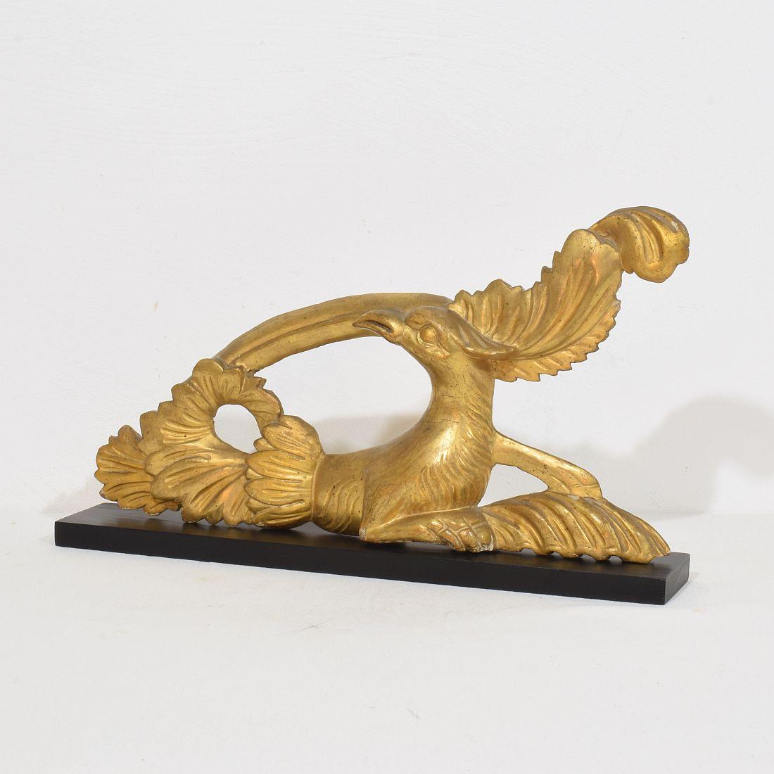 Beautiful handcarved giltwood bird ornament. 
Italy circa 1780-1820 . Weathered and small losses
Measurements individual and include the wooden base.
H:23,5cm  W:41cm D:6,5cm 