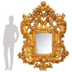 Specchio italiano del XVIII secolo in legno dorato di epoca barocca