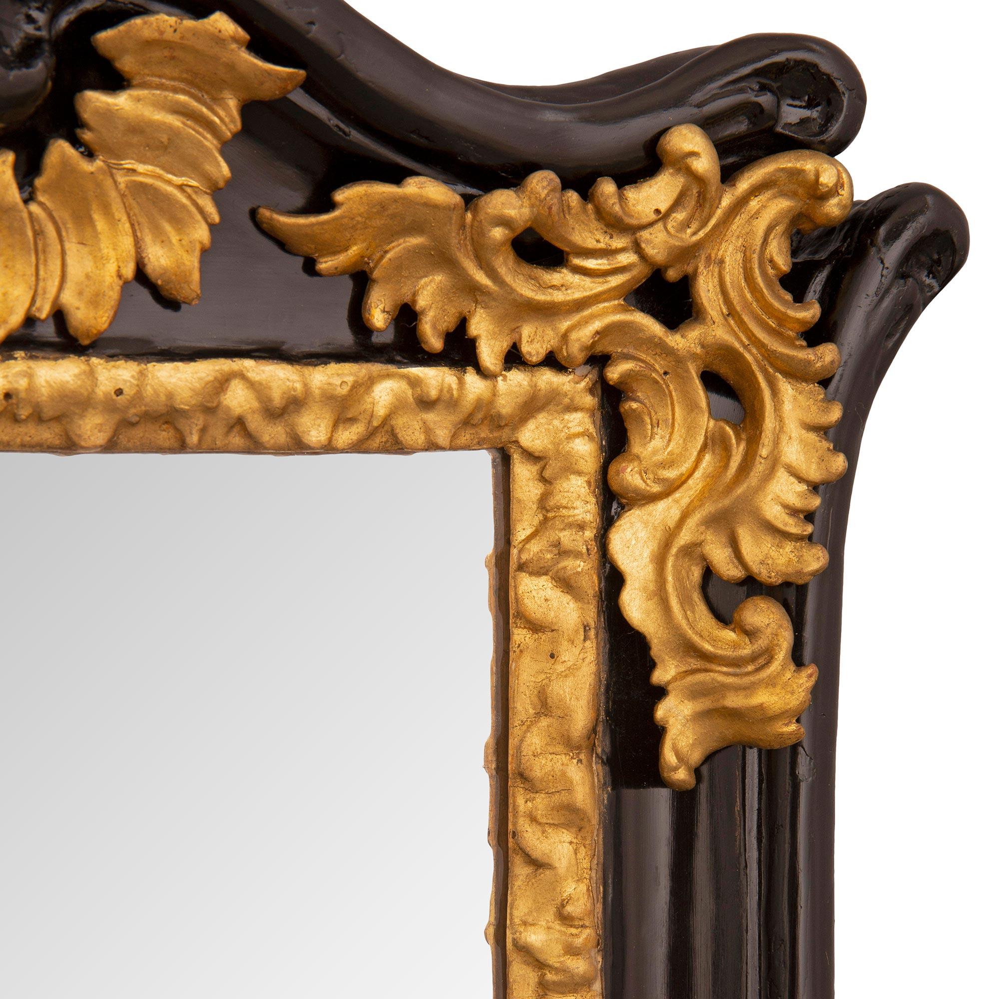 Italian 18th Century Baroque St. Ebonized Fruitwood and Giltwood Mirror For Sale 1