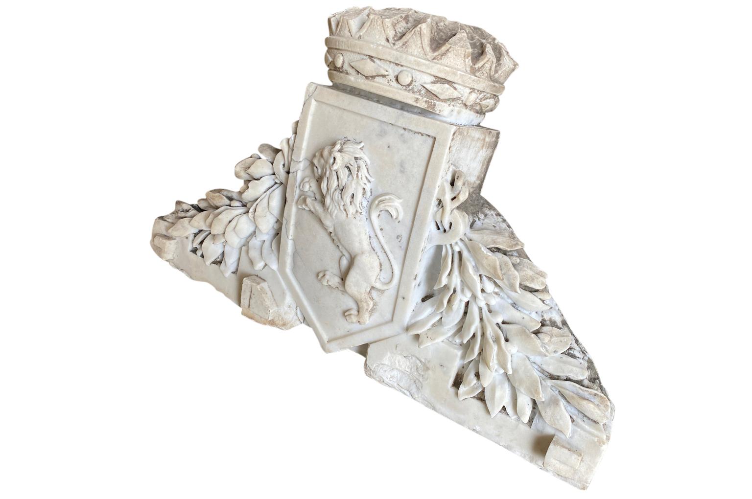 A very stunning 18th century Italian Blasson - Family Crest. Expertly carved from Carrara Marble with heraldic lion, a crown and vines. A spectacular piece for any interior of garden.